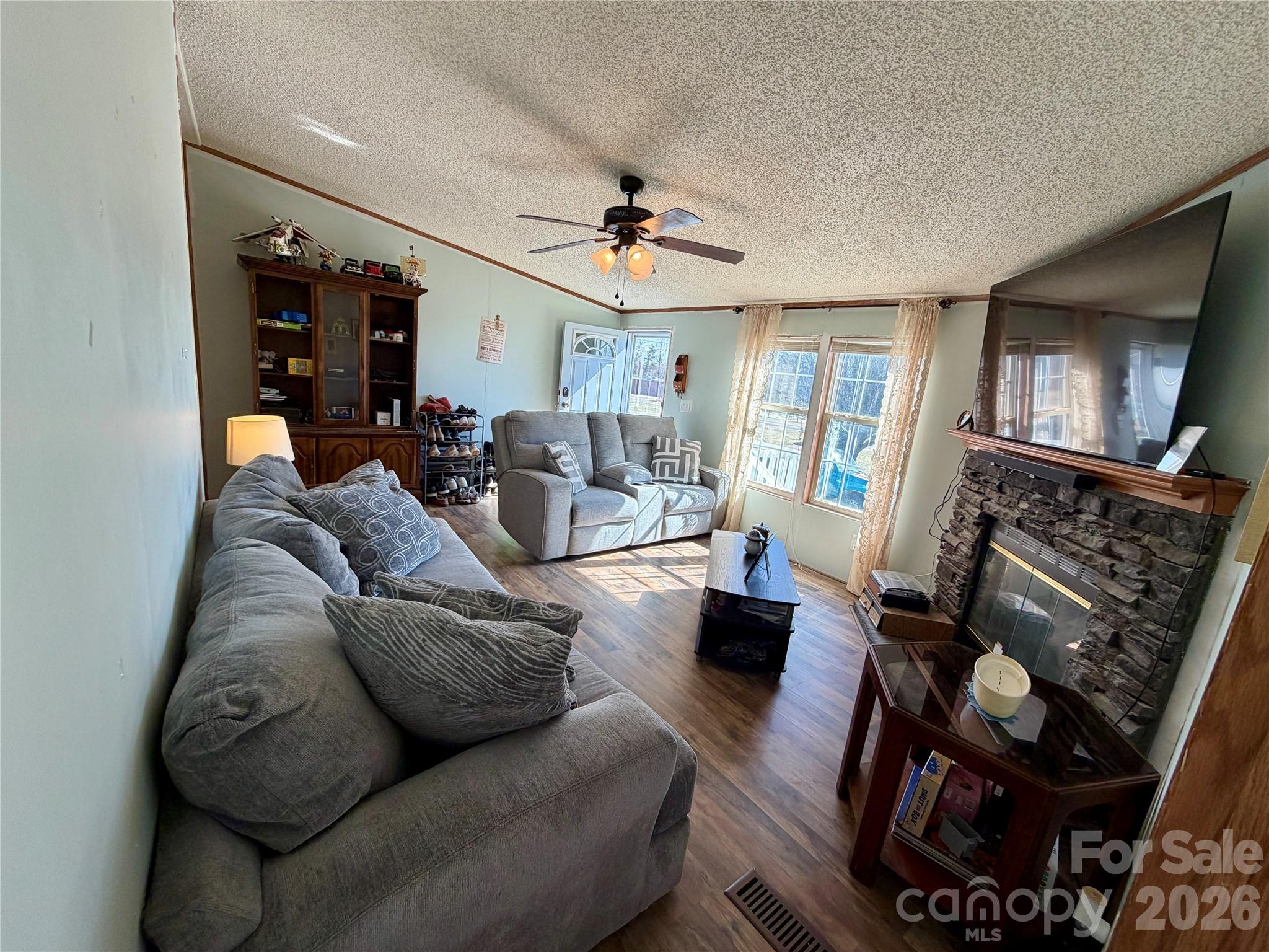 2390 Claremont Road Newton, NC 28658 - Photo 11 of 11 a living room with furniture and a fireplace