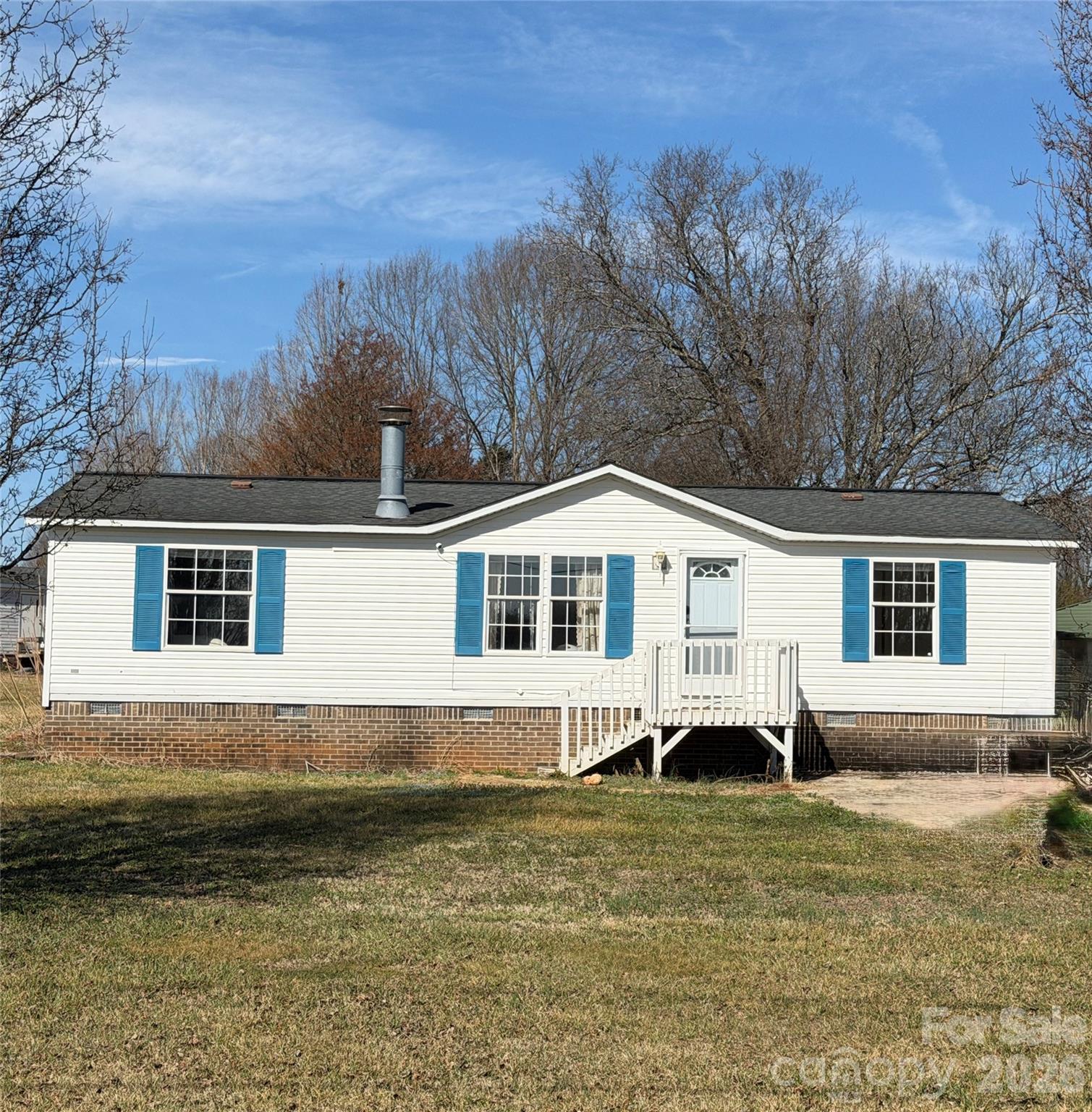 2390 Claremont Road Newton, NC 28658 - Photo 2 of 11 a front view of a house with a yard