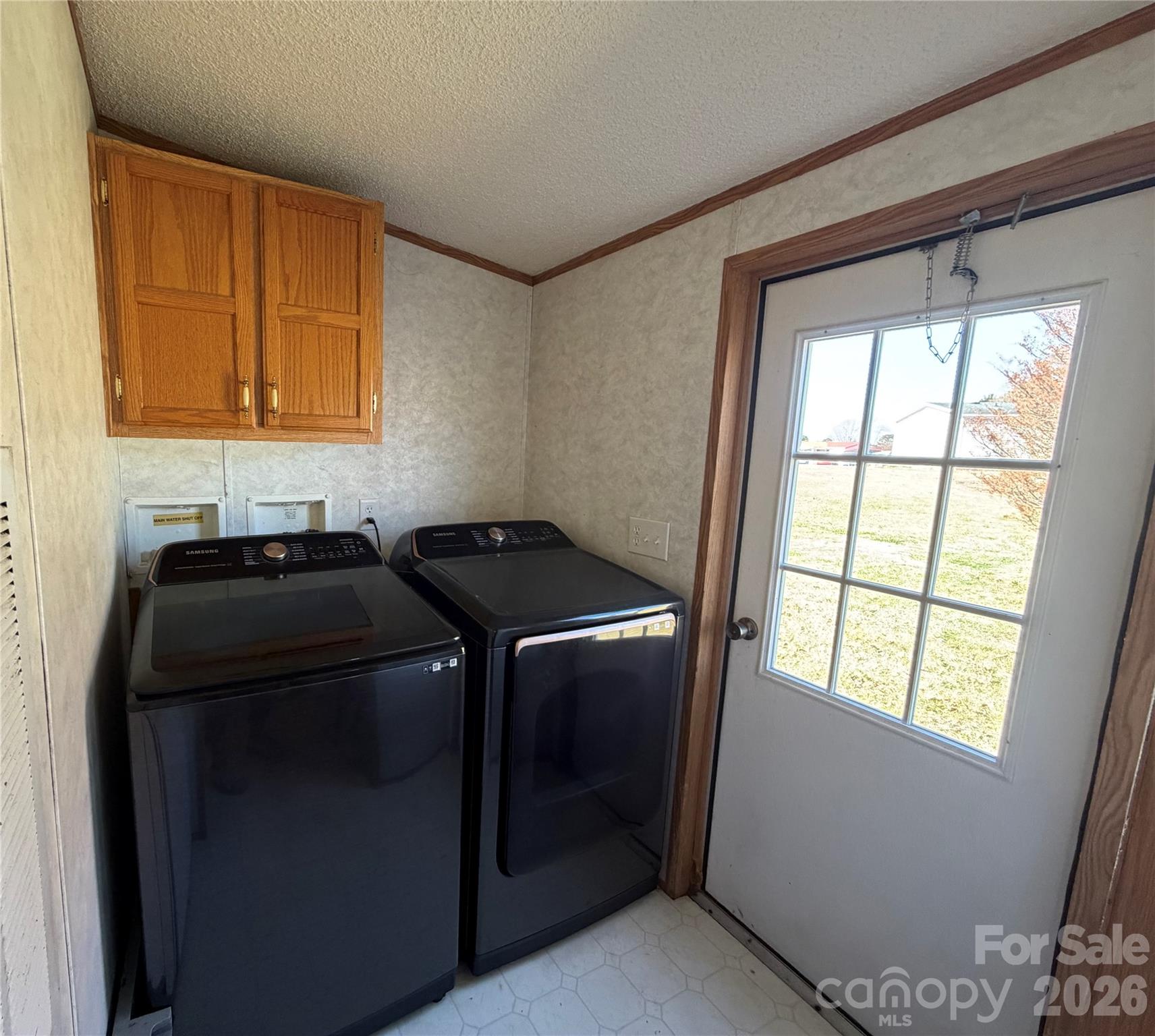 2390 Claremont Road Newton, NC 28658 - Photo 3 of 11 a kitchen with a stove and a window