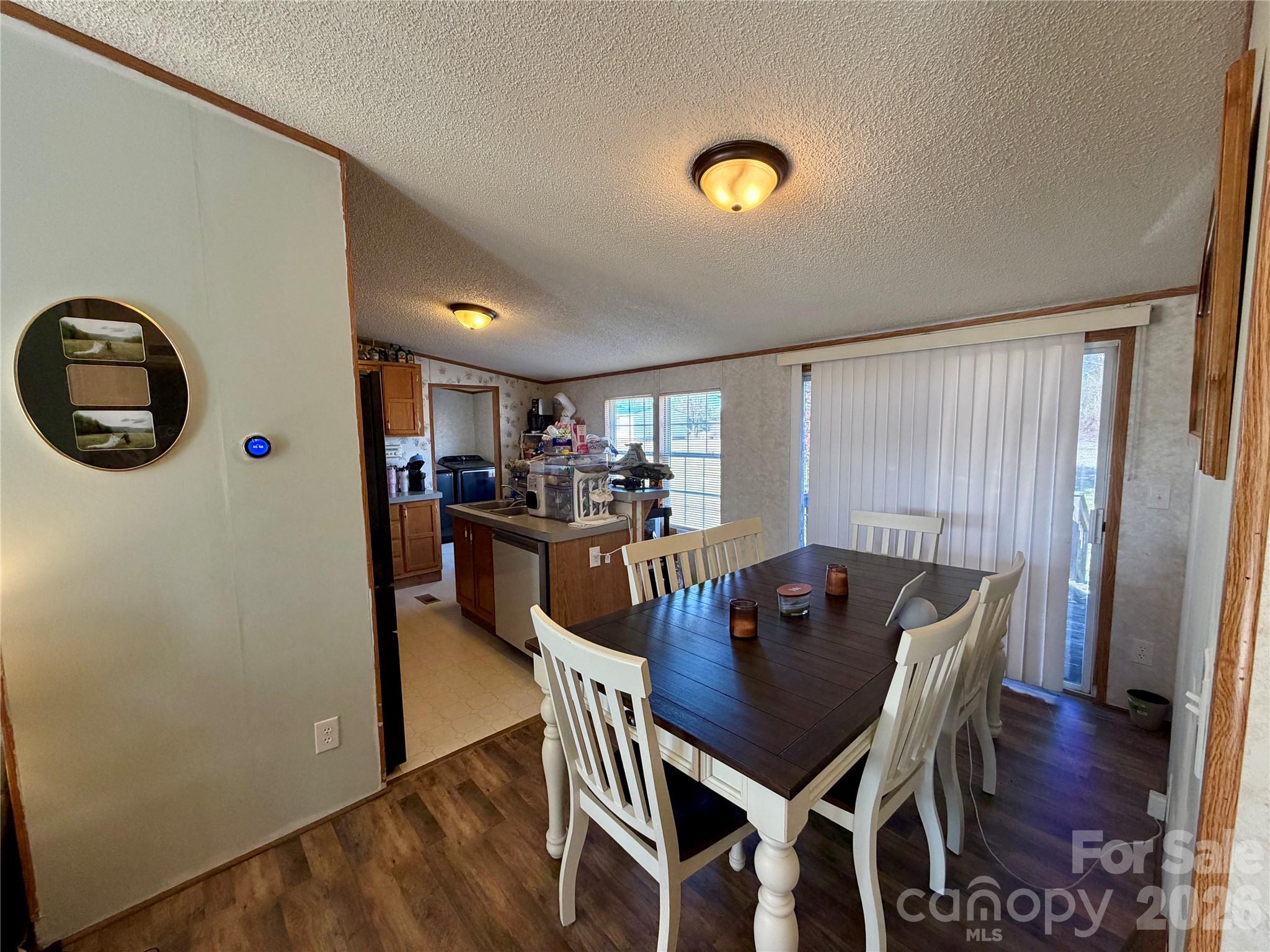2390 Claremont Road Newton, NC 28658 - Photo 5 of 11 a view of a dining room with furniture and wooden floor