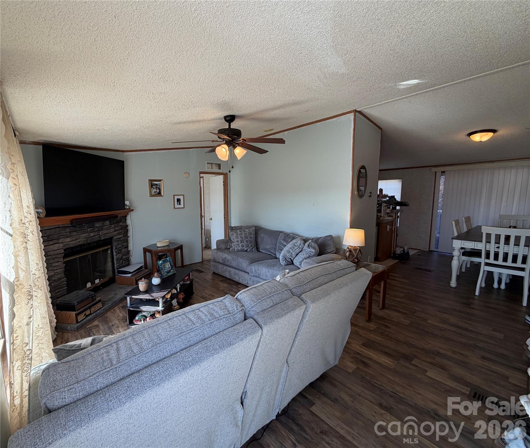 2390 Claremont Road Newton, NC 28658 - Photo 10 of 11 a living room with furniture and a flat screen tv