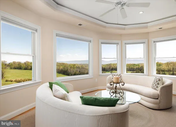 a large bed sitting in a bedroom and a table