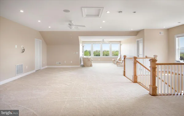 a living room with furniture a table and a large window