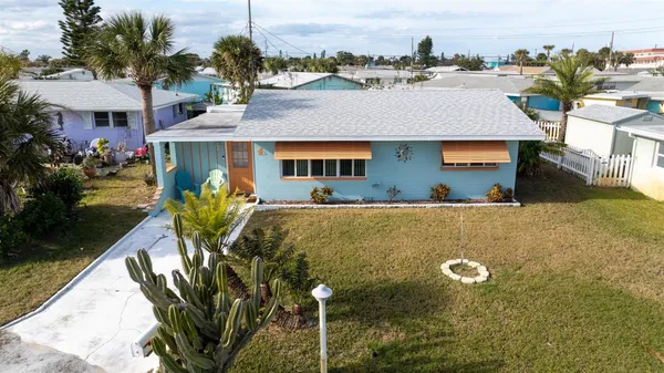 a aerial view of a house with a yard