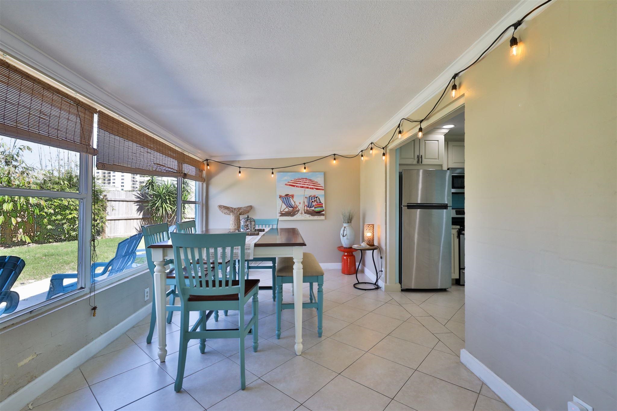 7 Azalea Drive Ormond Beach, FL 32176 - Photo 13 of 46 a dining room filled with furniture and a window