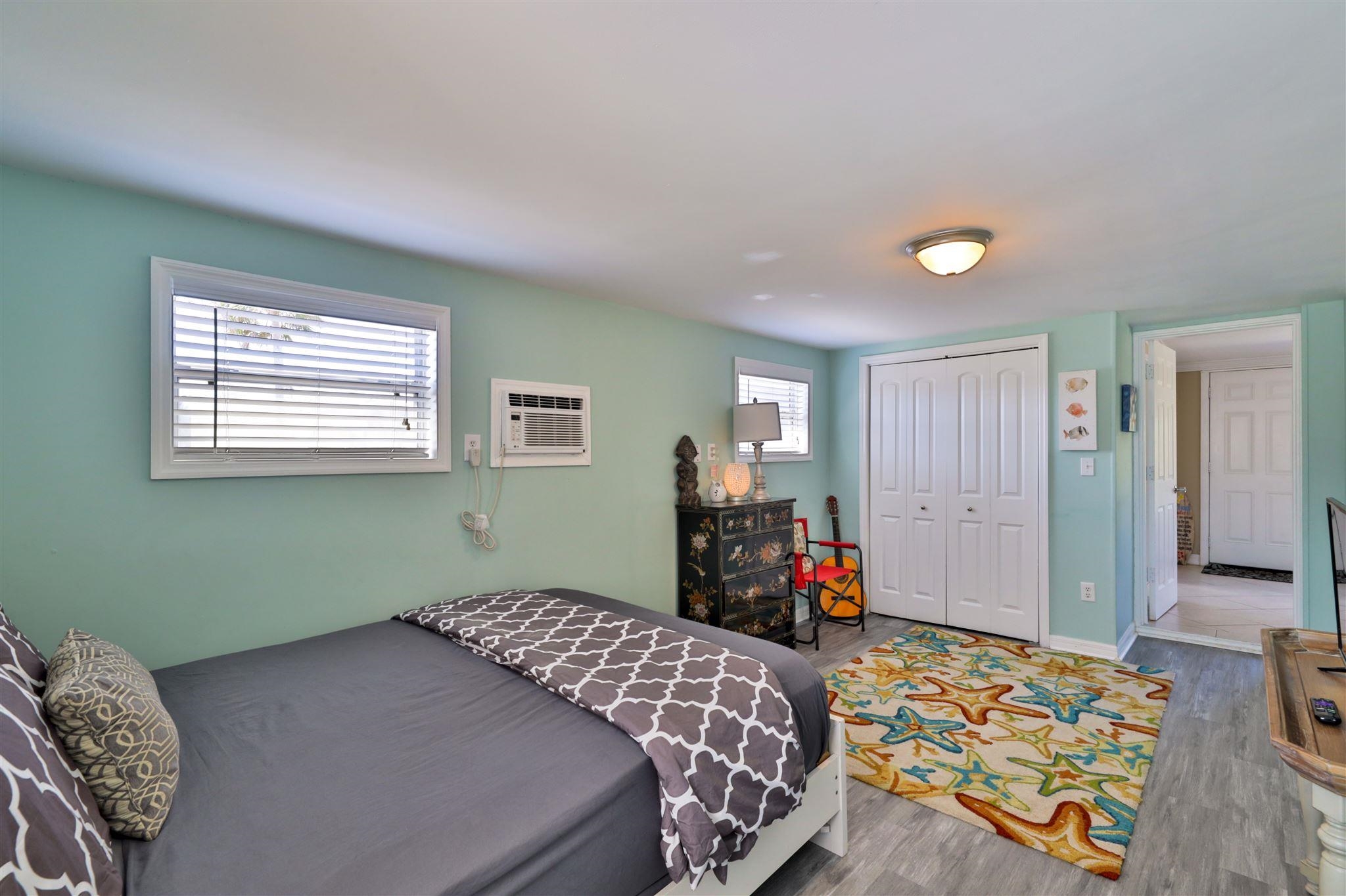 7 Azalea Drive Ormond Beach, FL 32176 - Photo 16 of 46 a bedroom with bed and a window