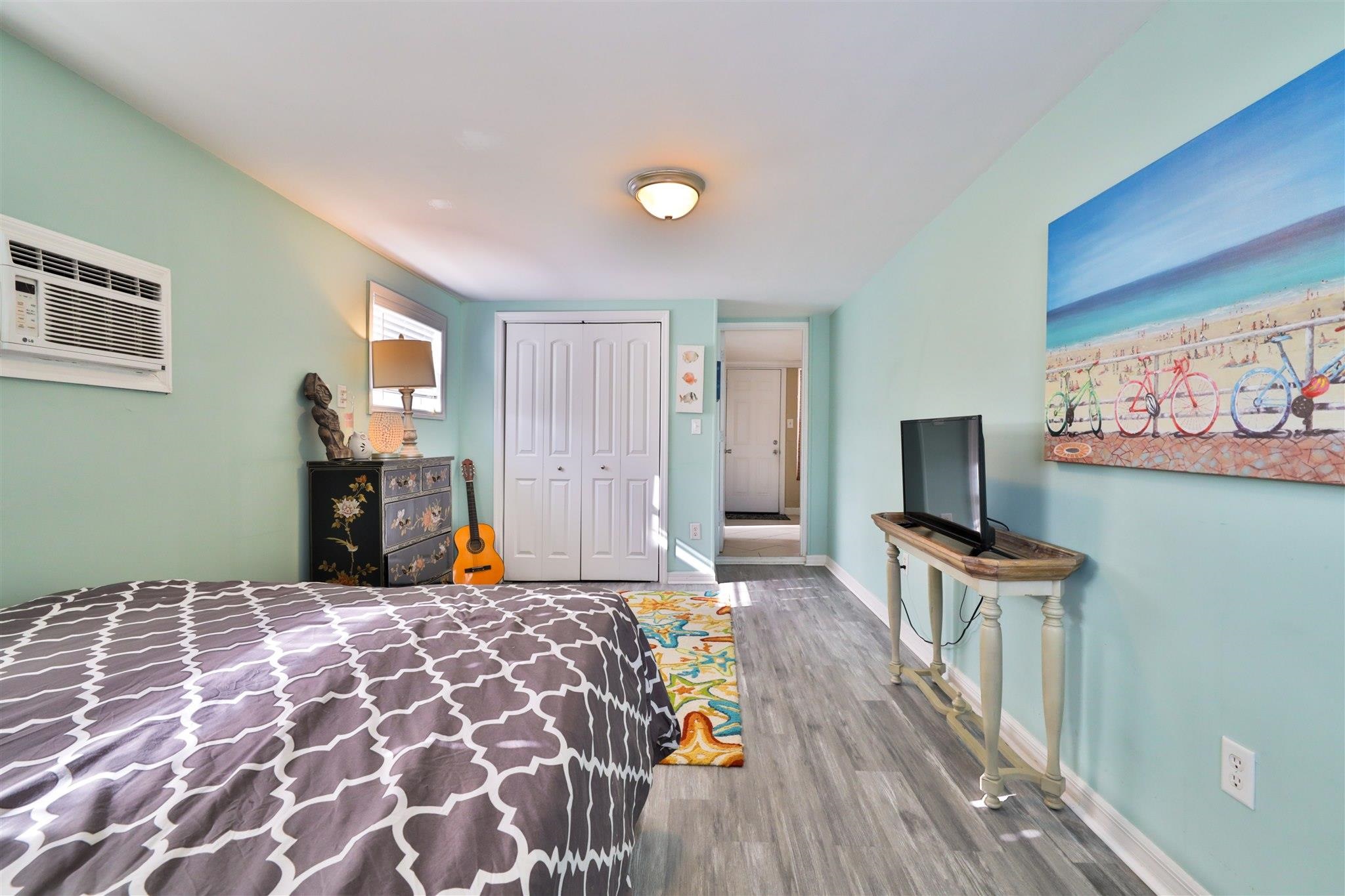 7 Azalea Drive Ormond Beach, FL 32176 - Photo 18 of 46 a bedroom with a bed and a flat screen tv