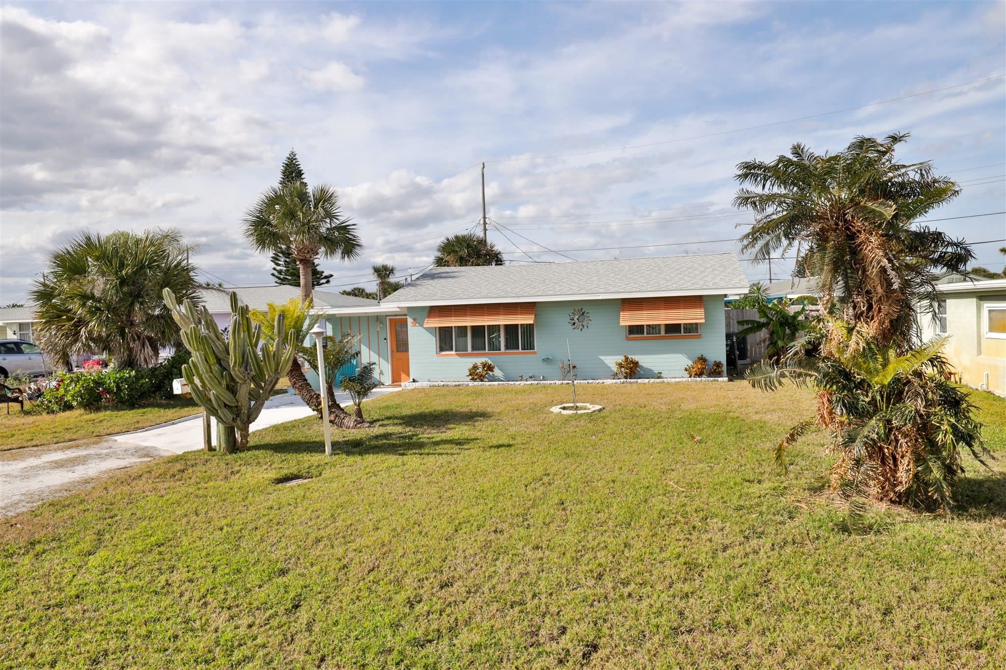 7 Azalea Drive Ormond Beach, FL 32176 - Photo 26 of 46 a front view of a house with garden