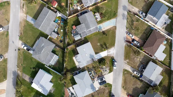 a aerial view of a house with a yard