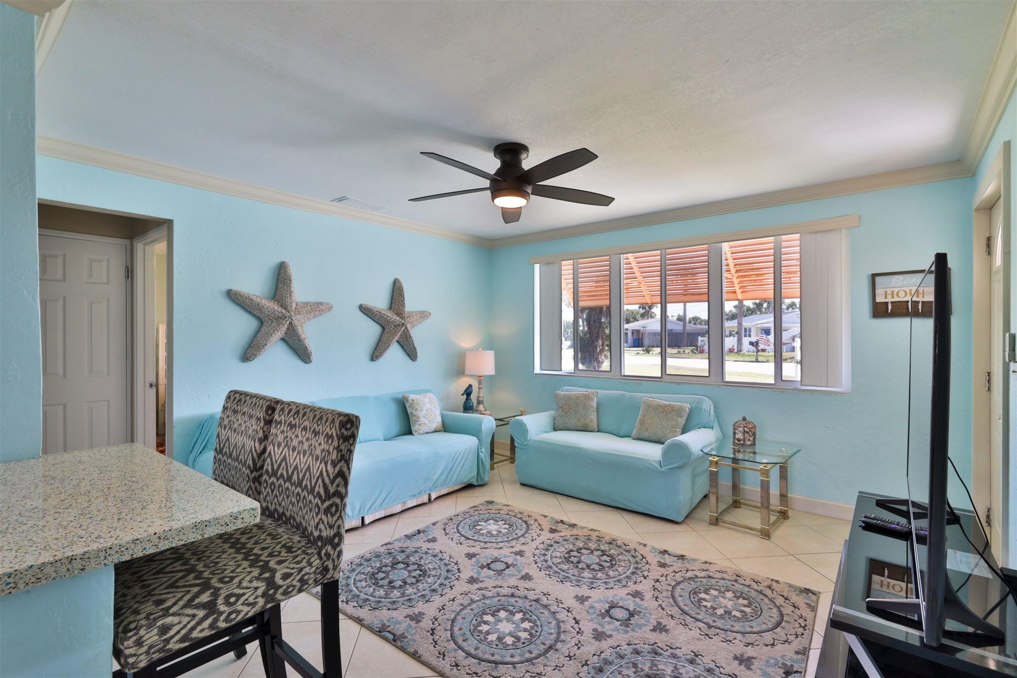 7 Azalea Drive Ormond Beach, FL 32176 - Photo 4 of 46 a living room with furniture and a large window