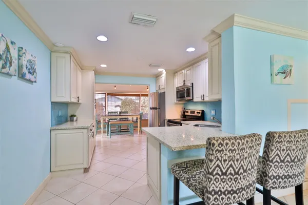 a kitchen with a stove microwave and refrigerator