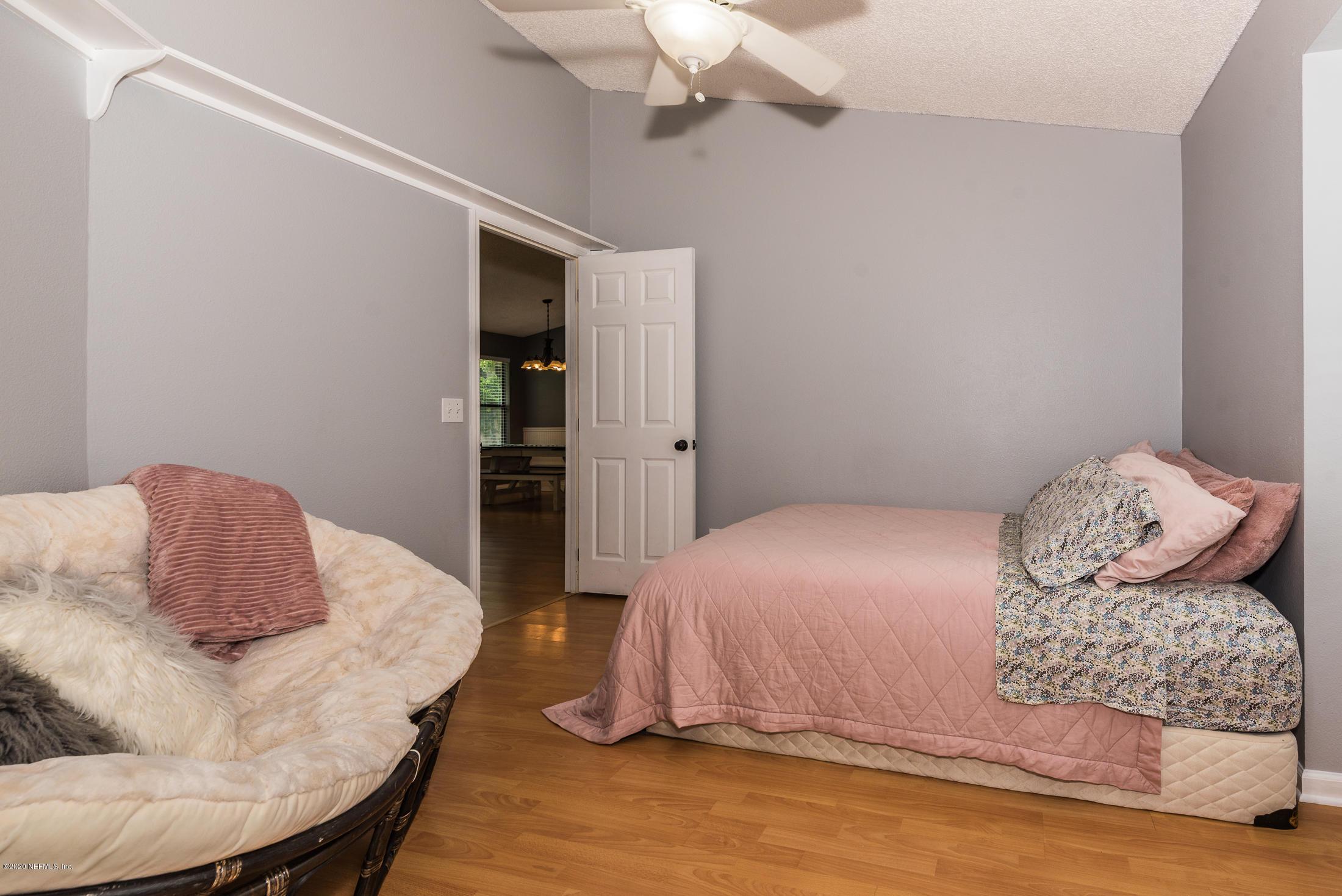136 Wisteria Road St. Augustine, FL 32086 - Photo 25 of 39 a bedroom with a bed and dresser