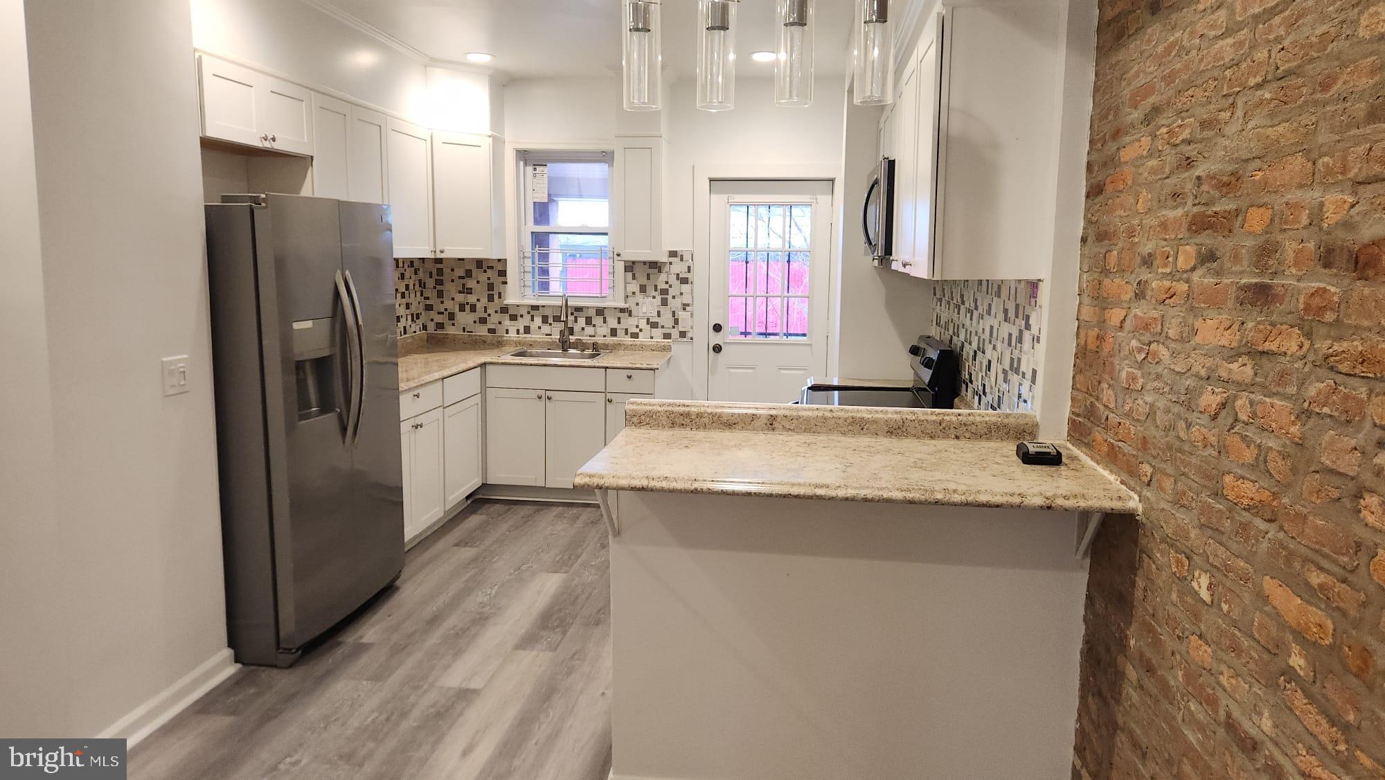 519 East 28th Street Baltimore, MD 21218 - Photo 11 of 46 Modern kitchen with stylish finishes.