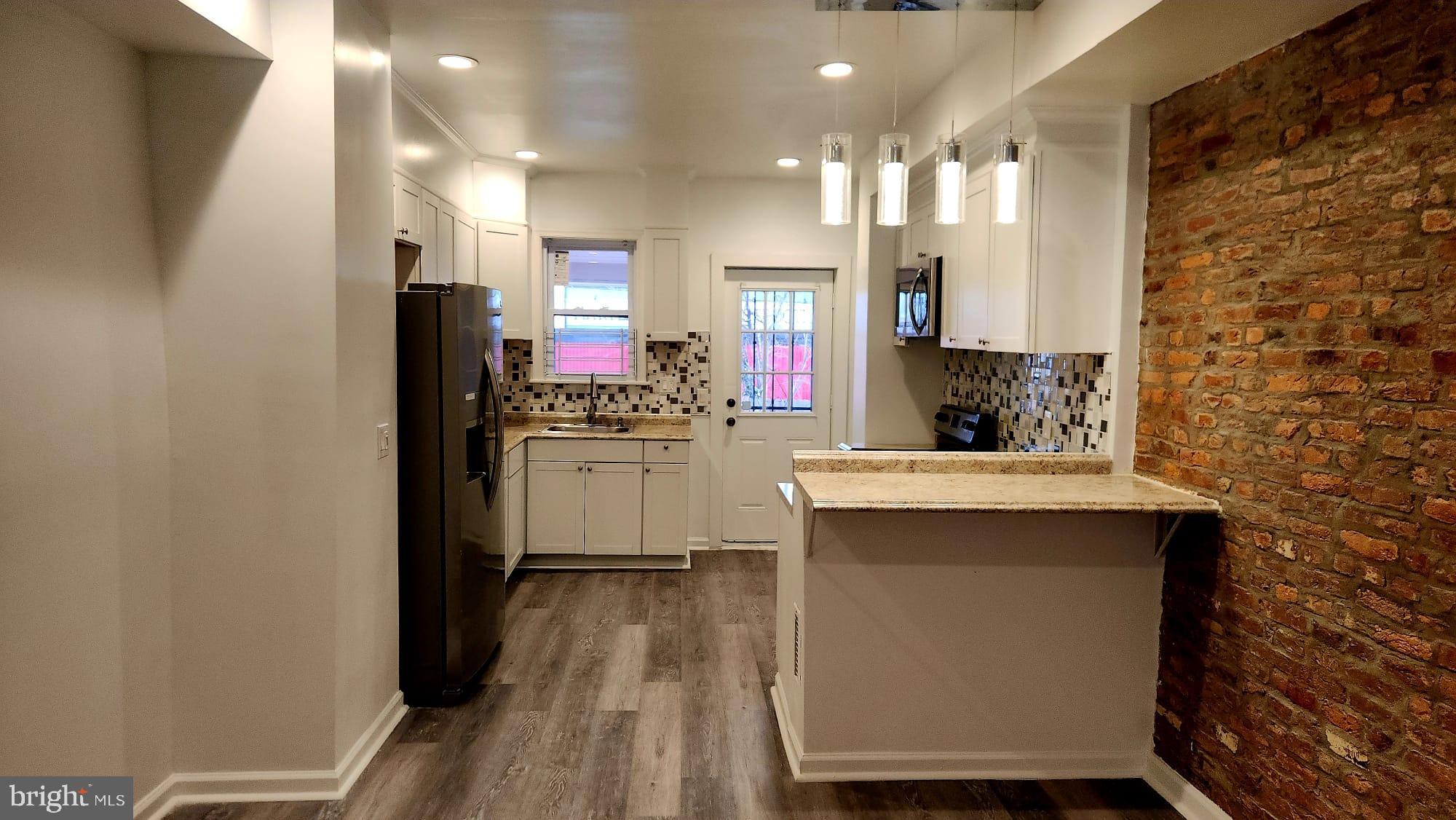 519 East 28th Street Baltimore, MD 21218 - Photo 12 of 46 Modern kitchen with stylish finishes.