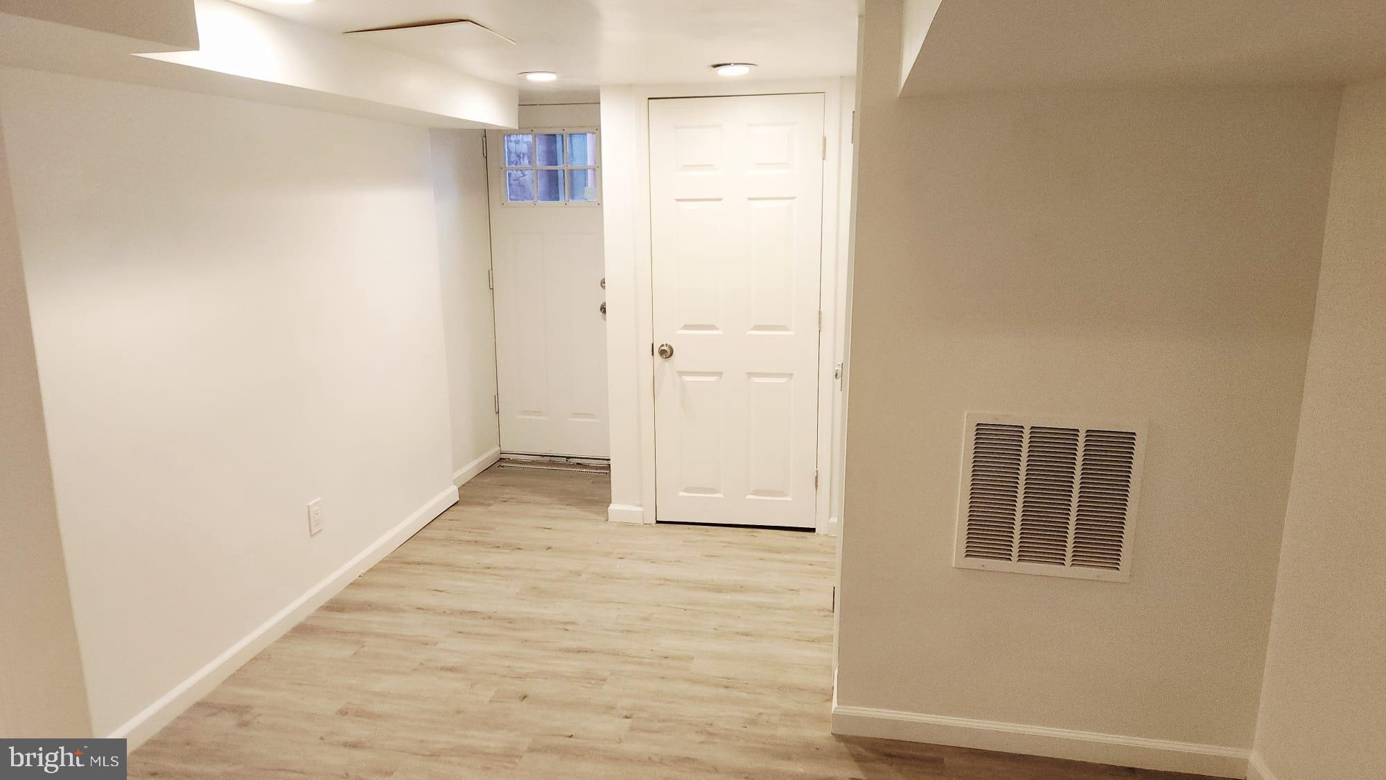 519 East 28th Street Baltimore, MD 21218 - Photo 14 of 46 Bright and inviting entryway with modern charm.