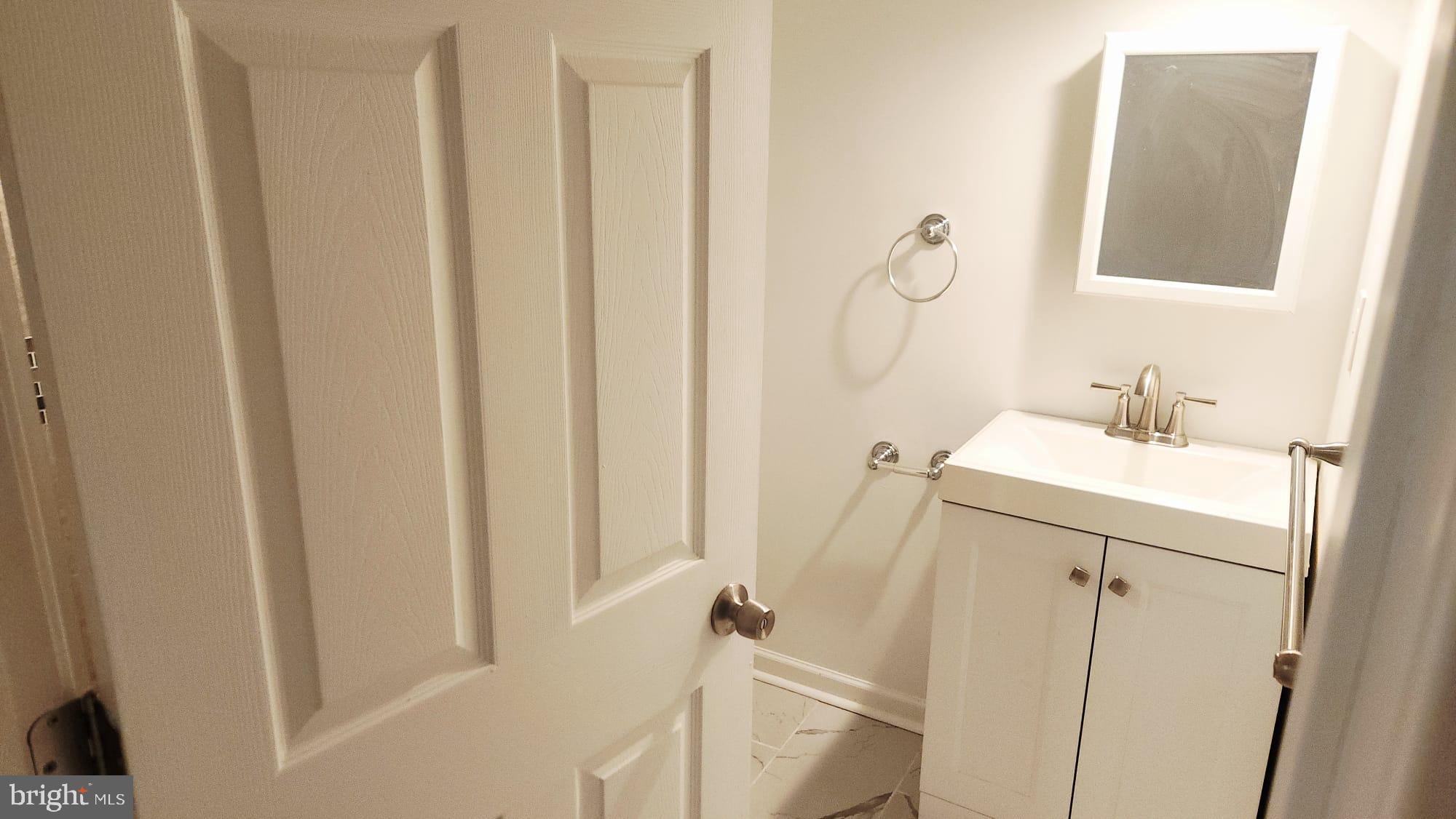 519 East 28th Street Baltimore, MD 21218 - Photo 18 of 46 Modern bathroom with sleek finishes.