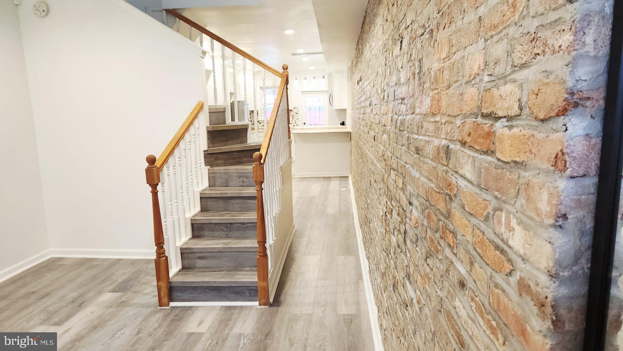 519 East 28th Street Baltimore, MD 21218 - Photo 2 of 46 Charming entryway with rustic brick accents.
