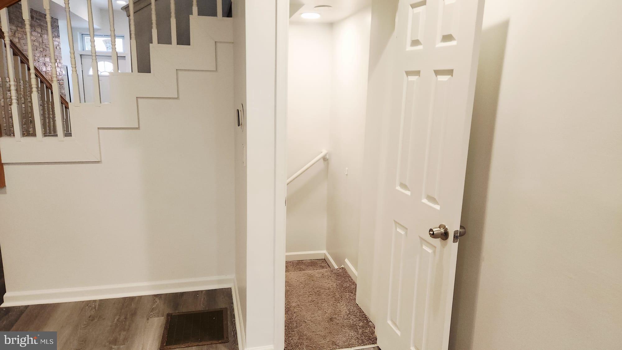 519 East 28th Street Baltimore, MD 21218 - Photo 28 of 46 Inviting entryway with staircase charm.