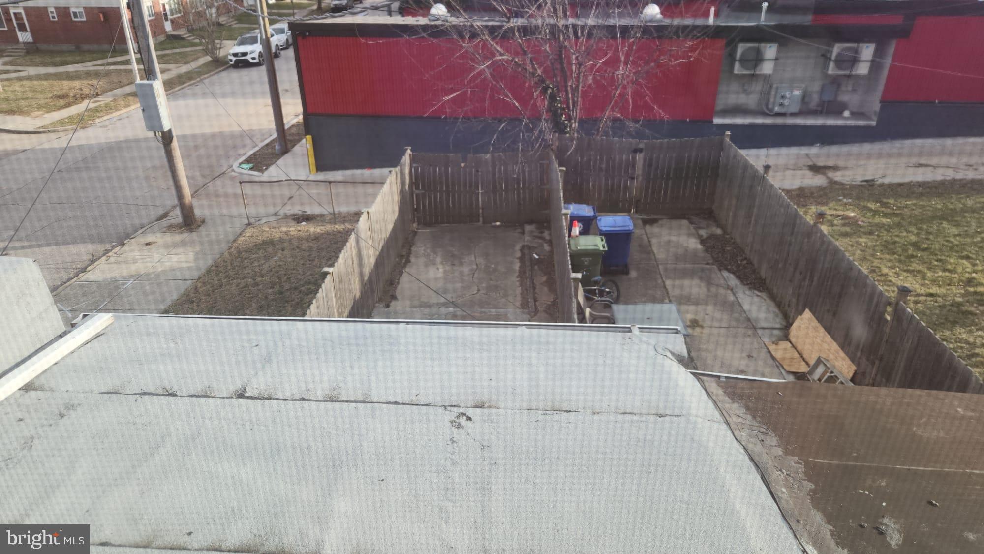 519 East 28th Street Baltimore, MD 21218 - Photo 30 of 46 Urban backyard with potential for transformation.