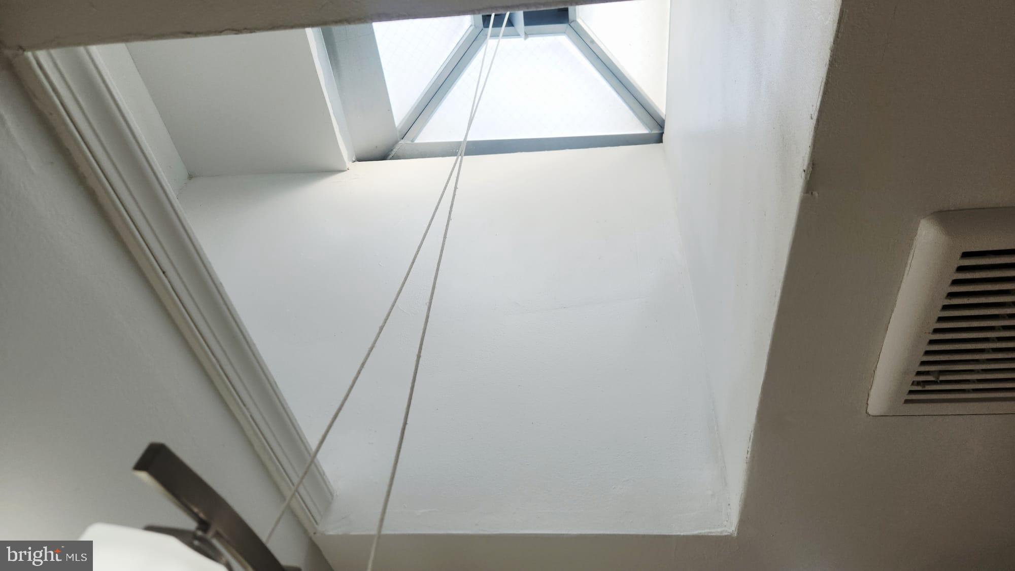 519 East 28th Street Baltimore, MD 21218 - Photo 35 of 46 Skyward view through a modern skylight.