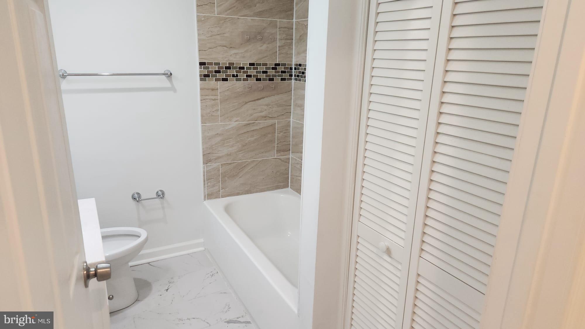 519 East 28th Street Baltimore, MD 21218 - Photo 36 of 46 Modern bathroom with elegant tile accents.