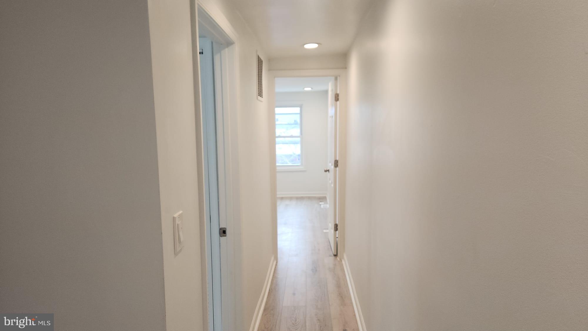 519 East 28th Street Baltimore, MD 21218 - Photo 41 of 46 Bright and inviting hallway with natural light.
