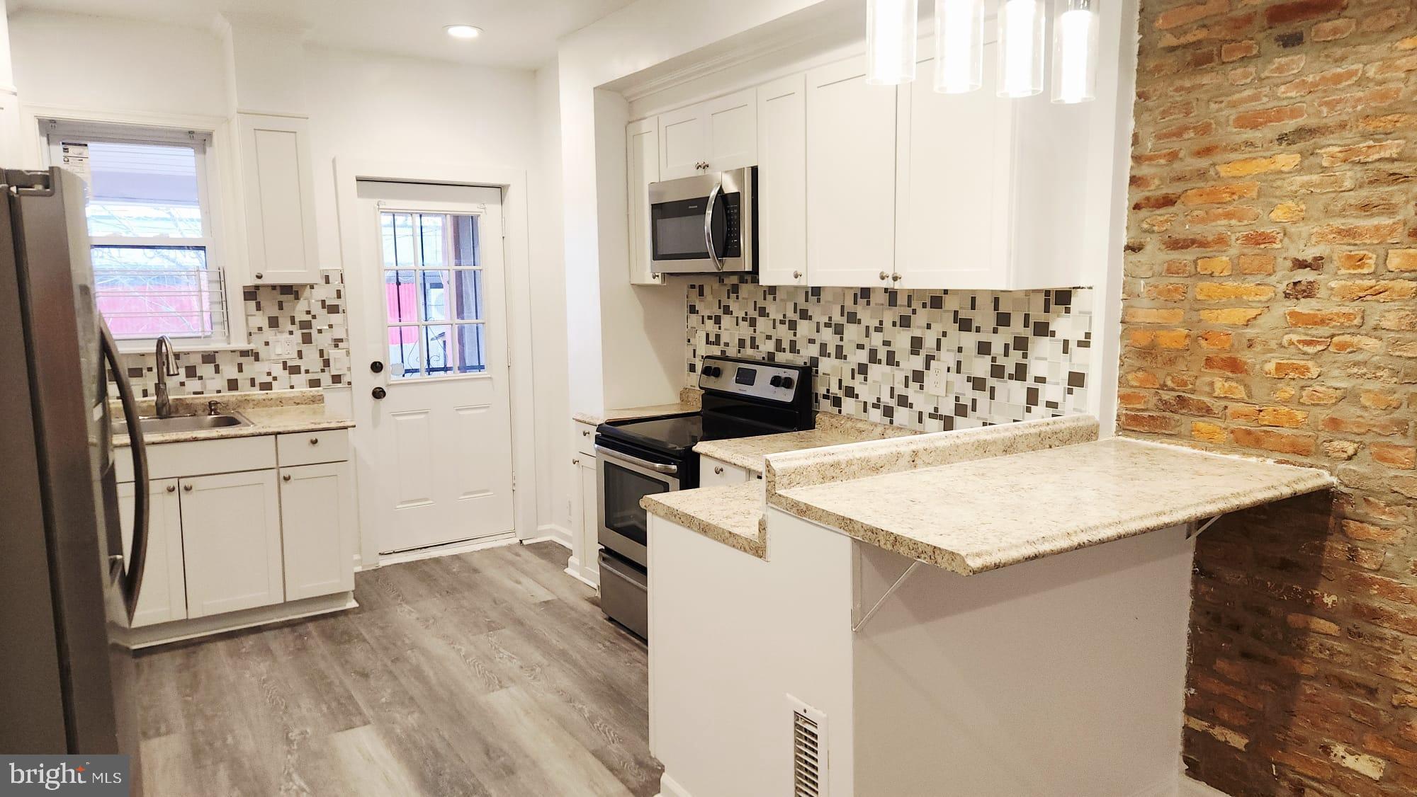519 East 28th Street Baltimore, MD 21218 - Photo 6 of 46 Modern kitchen with stylish finishes.