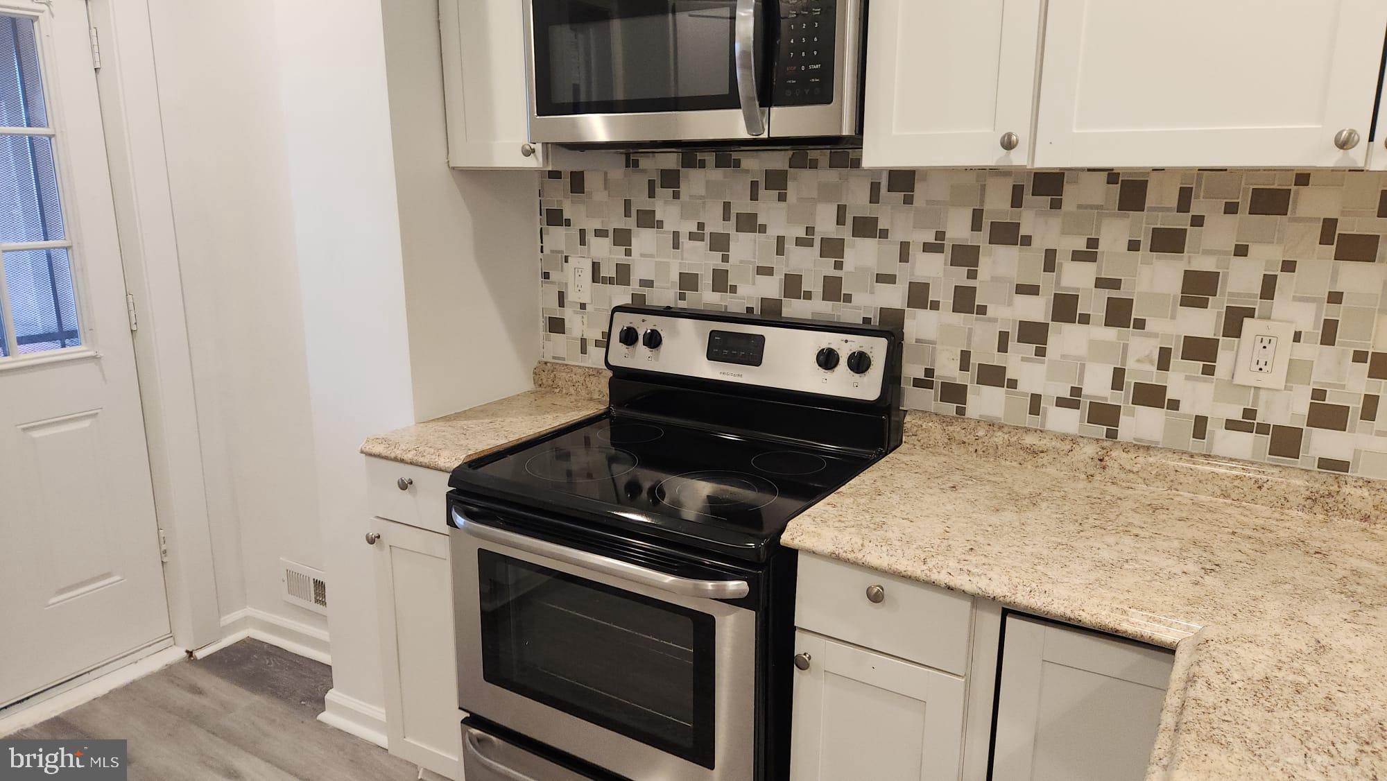 519 East 28th Street Baltimore, MD 21218 - Photo 8 of 46 Modern kitchen with sleek finishes.