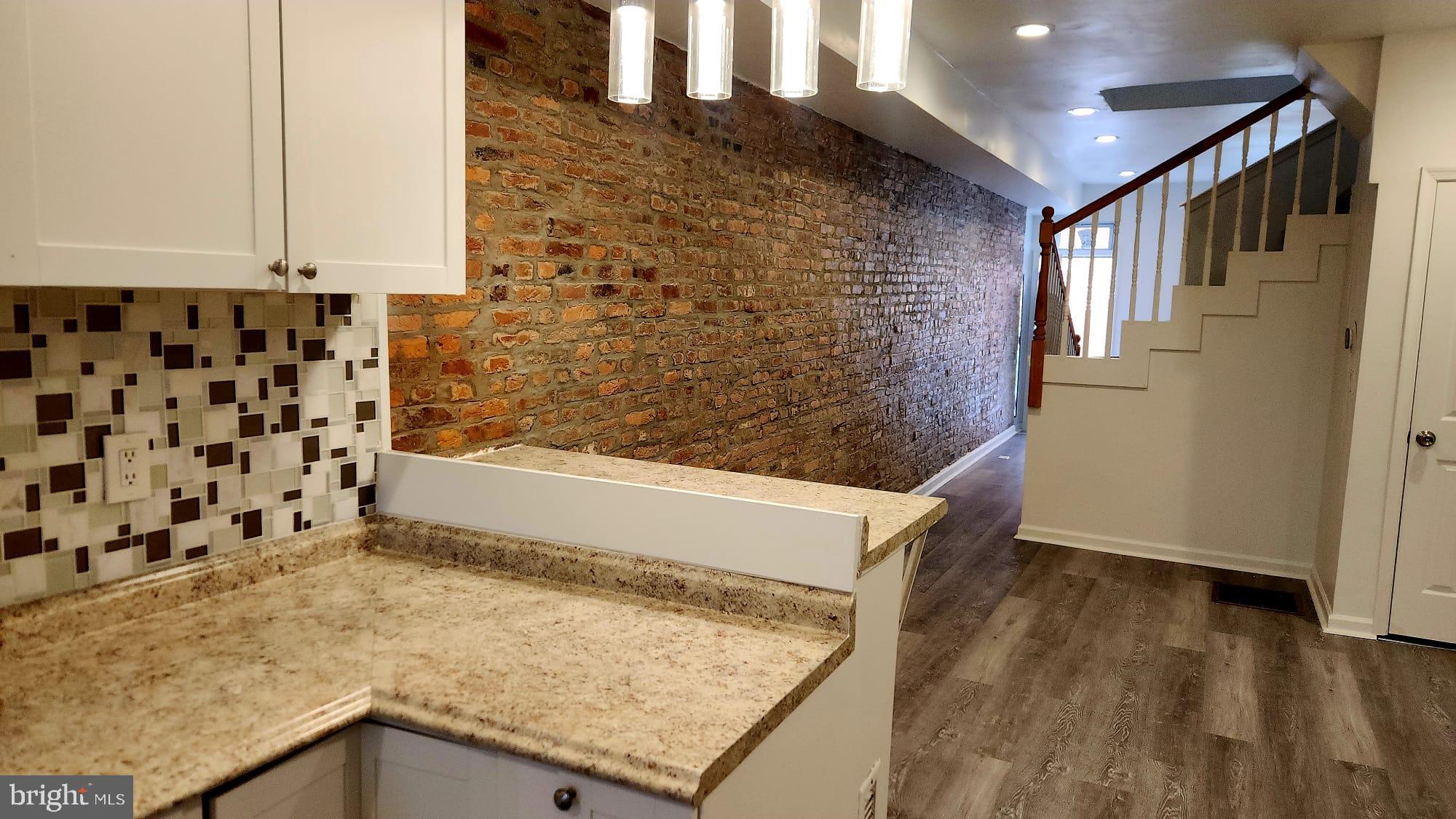 519 East 28th Street Baltimore, MD 21218 - Photo 9 of 46 Charming urban retreat with exposed brick.