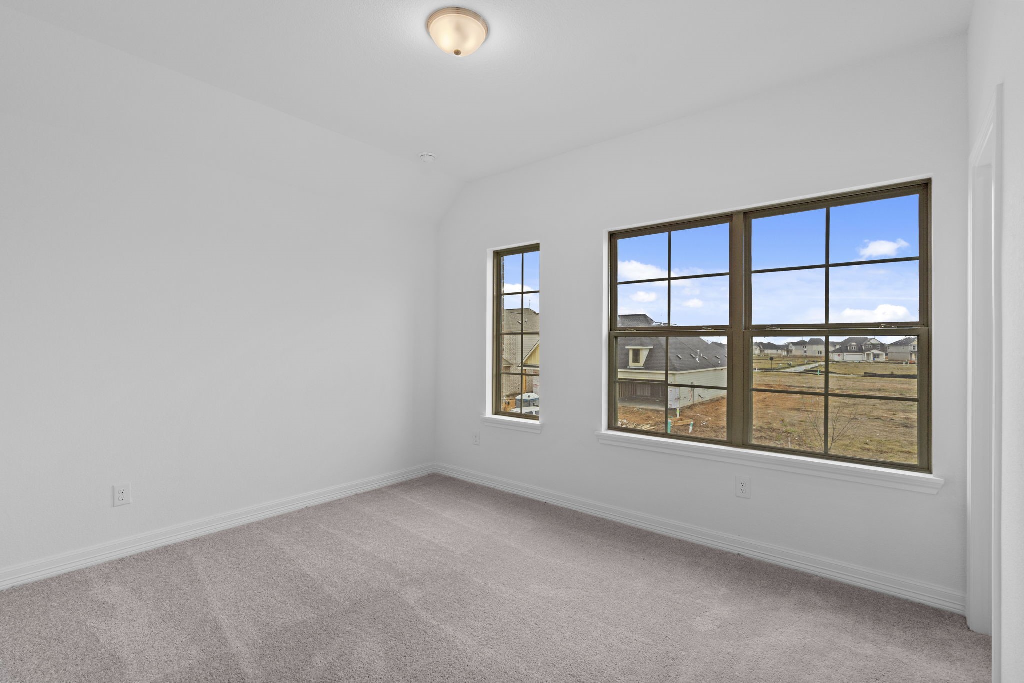 10639 Forward Street Richmond, TX 77469 - Photo 15 of 31 A thoughtfully designed secondary bedroom where traditional charm meets modern comfort.