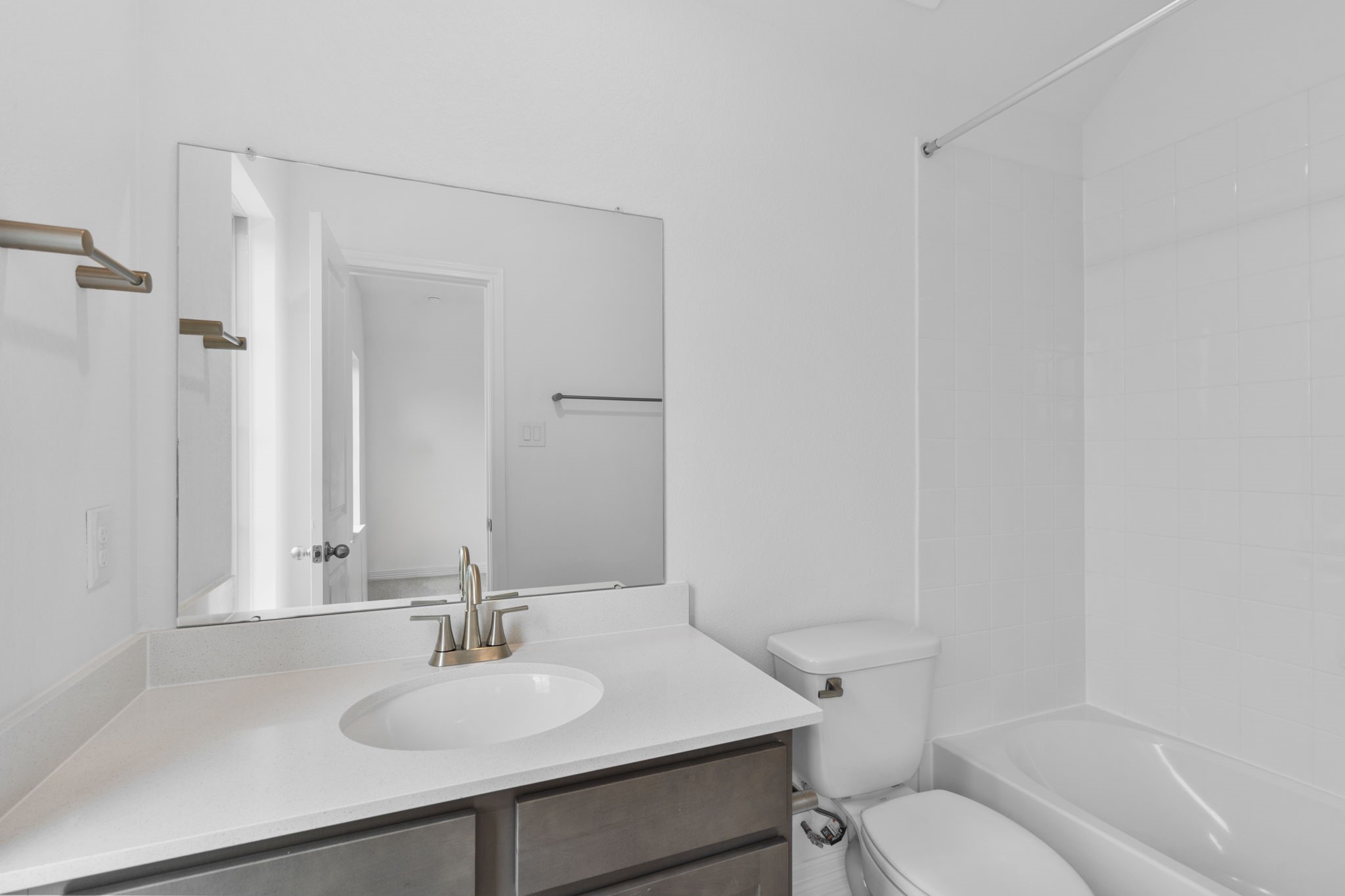 10639 Forward Street Richmond, TX 77469 - Photo 16 of 31 A secondary bathroom featuring classic finishes of the AW Roosevelt Collection, with stained cabinetry and lustrous nickel fixtures.