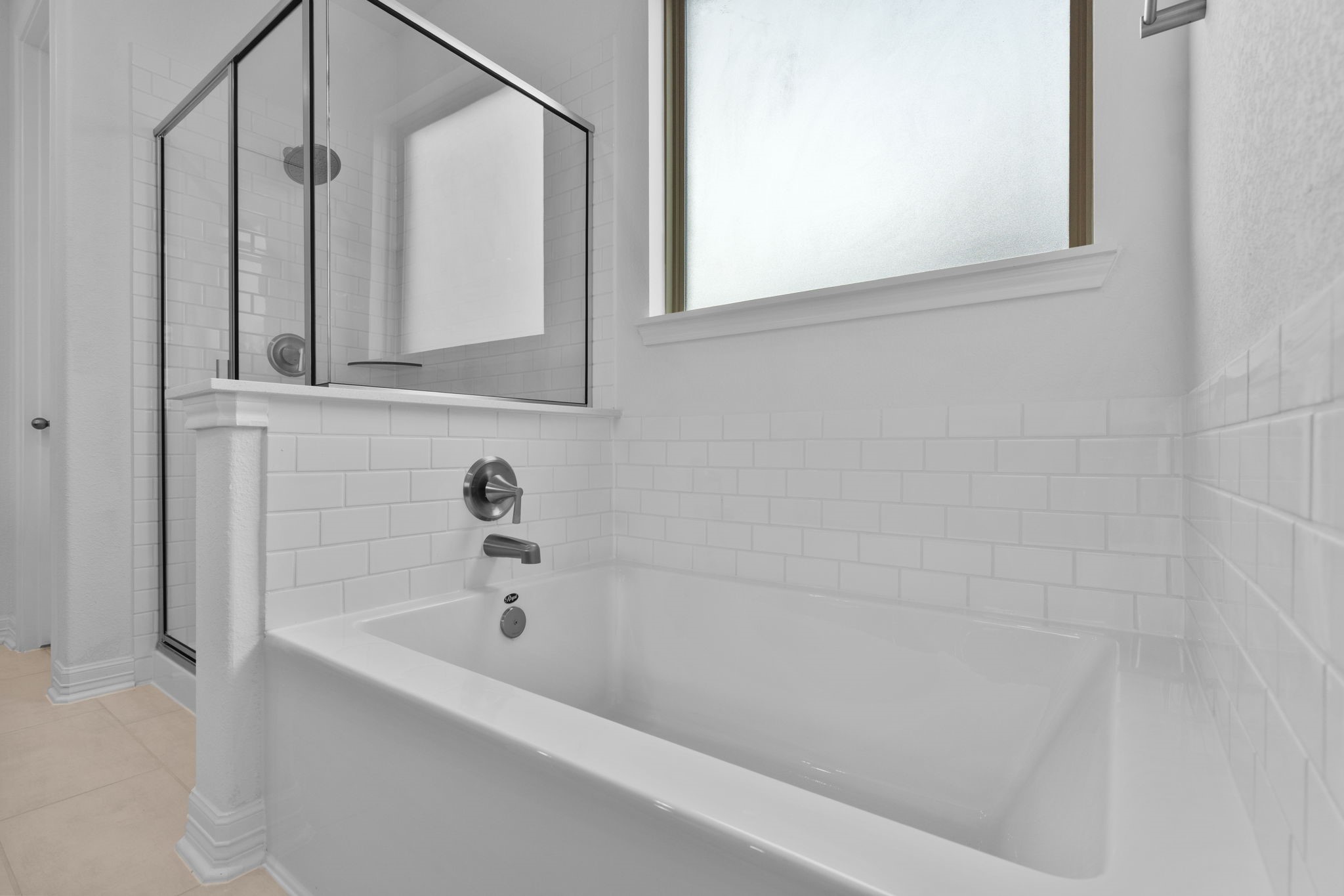 10639 Forward Street Richmond, TX 77469 - Photo 9 of 31 The primary bath offers a spa-like escape with a soaking tub, separate shower, and timeless New Traditional detailing.