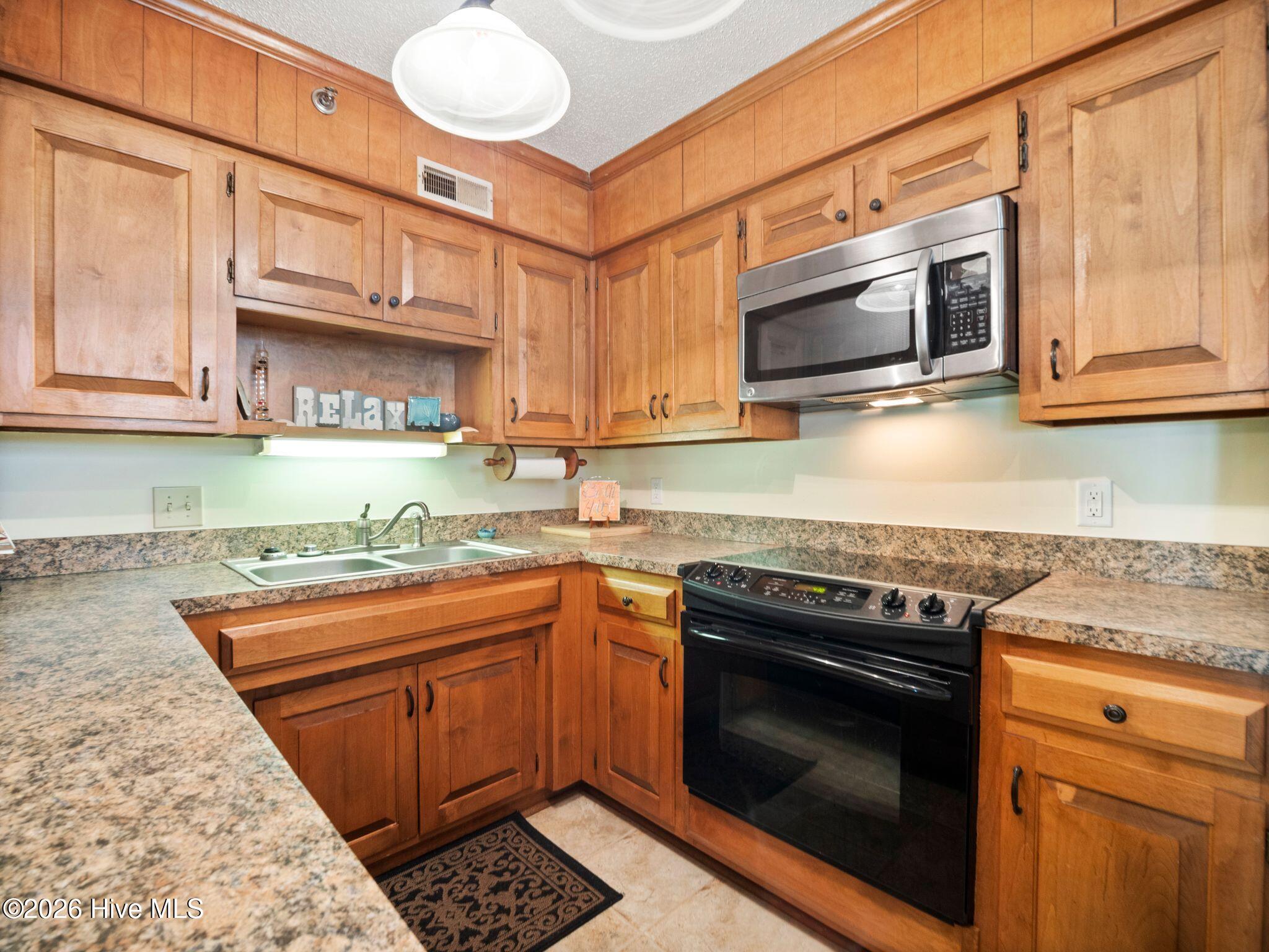 1896 New River Inlet Road, Unit 1119 North Topsail Beach, NC 28460 - Photo 15 of 39 Kitchen
