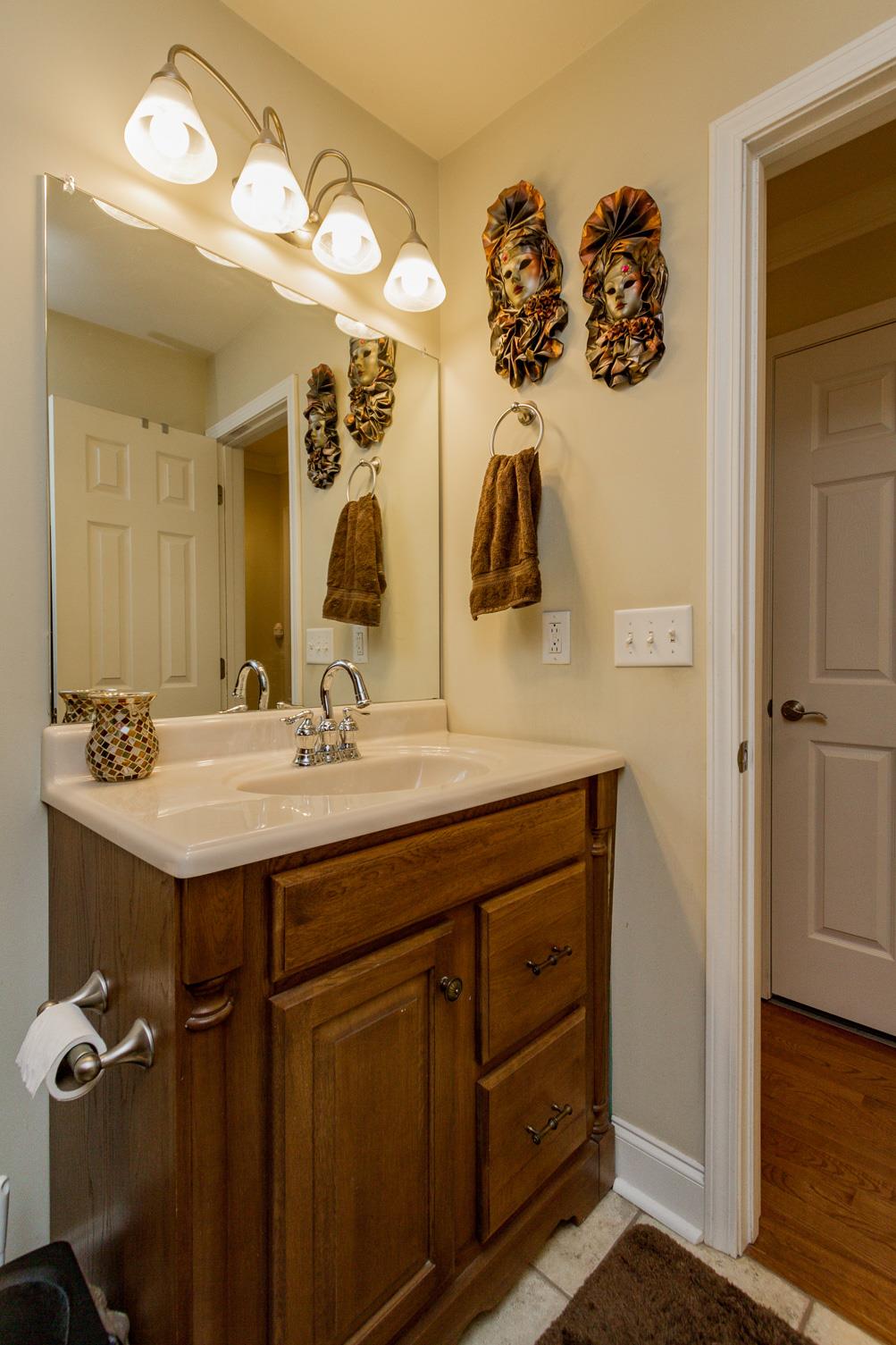 3701 Oakland Road Springfield, TN 37172 - Photo 11 of 22 a bathroom with a granite countertop sink a mirror and vanity