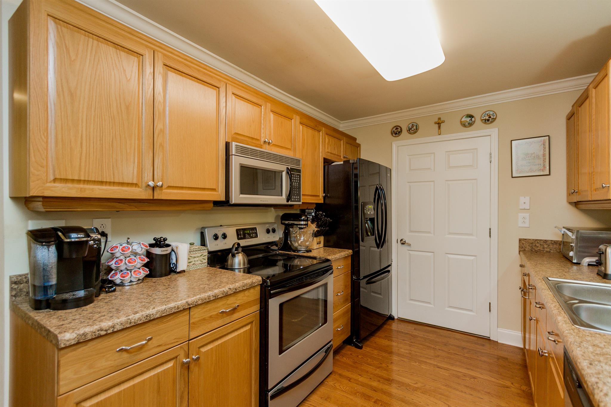 3701 Oakland Road Springfield, TN 37172 - Photo 7 of 22 a kitchen with stainless steel appliances granite countertop a stove a sink and a refrigerator