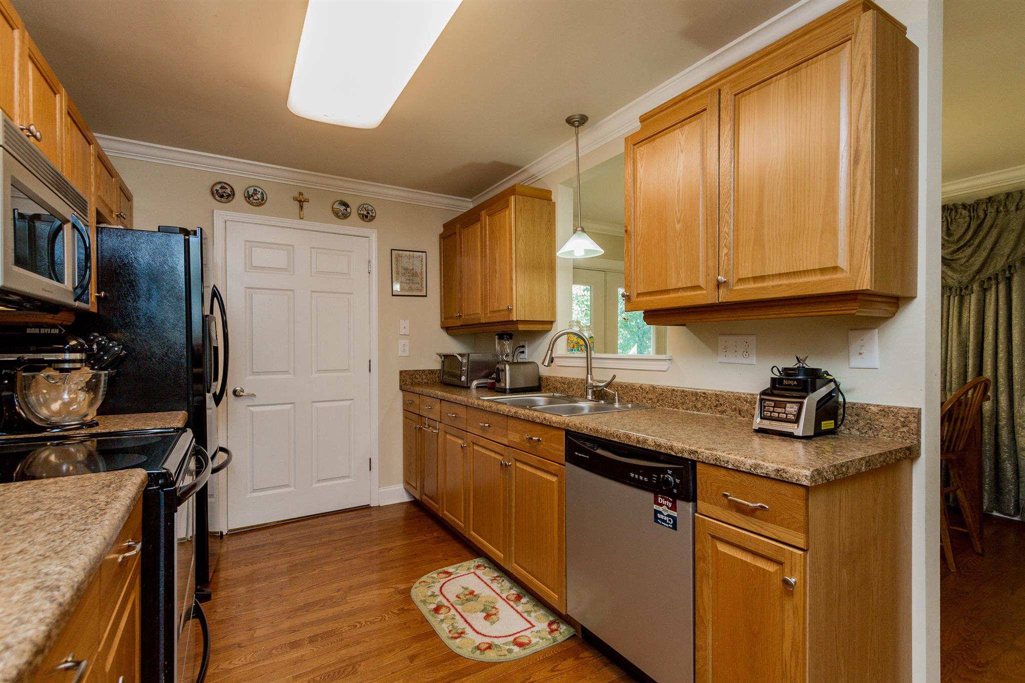 3701 Oakland Road Springfield, TN 37172 - Photo 8 of 22 a kitchen with stainless steel appliances granite countertop a sink stove and refrigerator