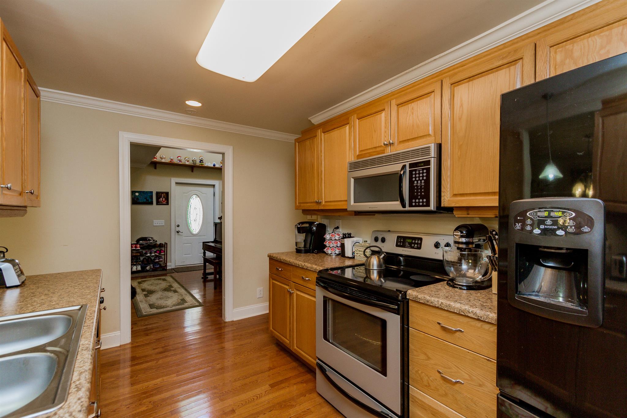 3701 Oakland Road Springfield, TN 37172 - Photo 9 of 22 a kitchen with stainless steel appliances granite countertop a stove and a microwave