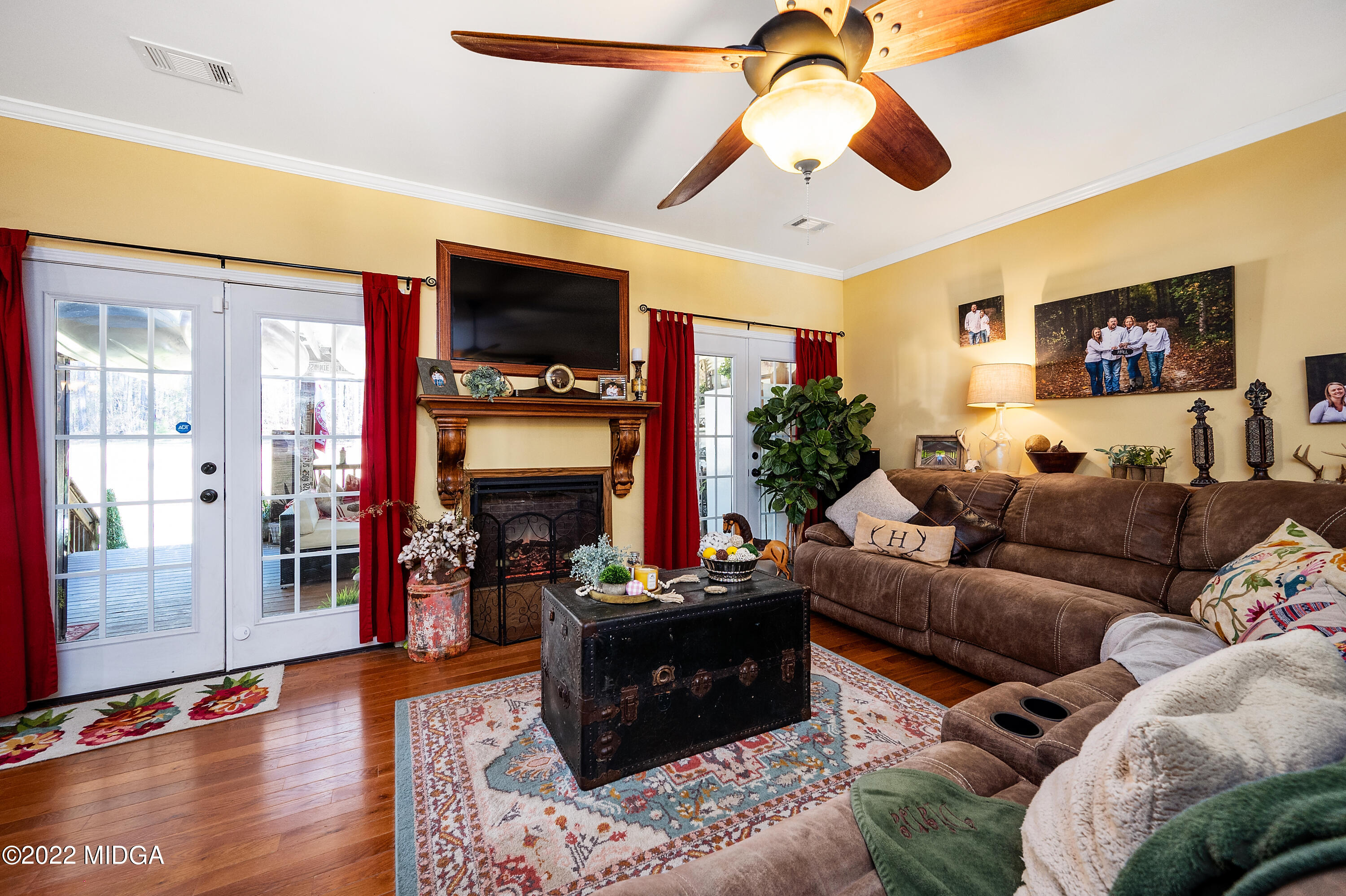 500 Gregory Road Forsyth, GA 31029 - Photo 14 of 47 a living room with furniture and a fireplace