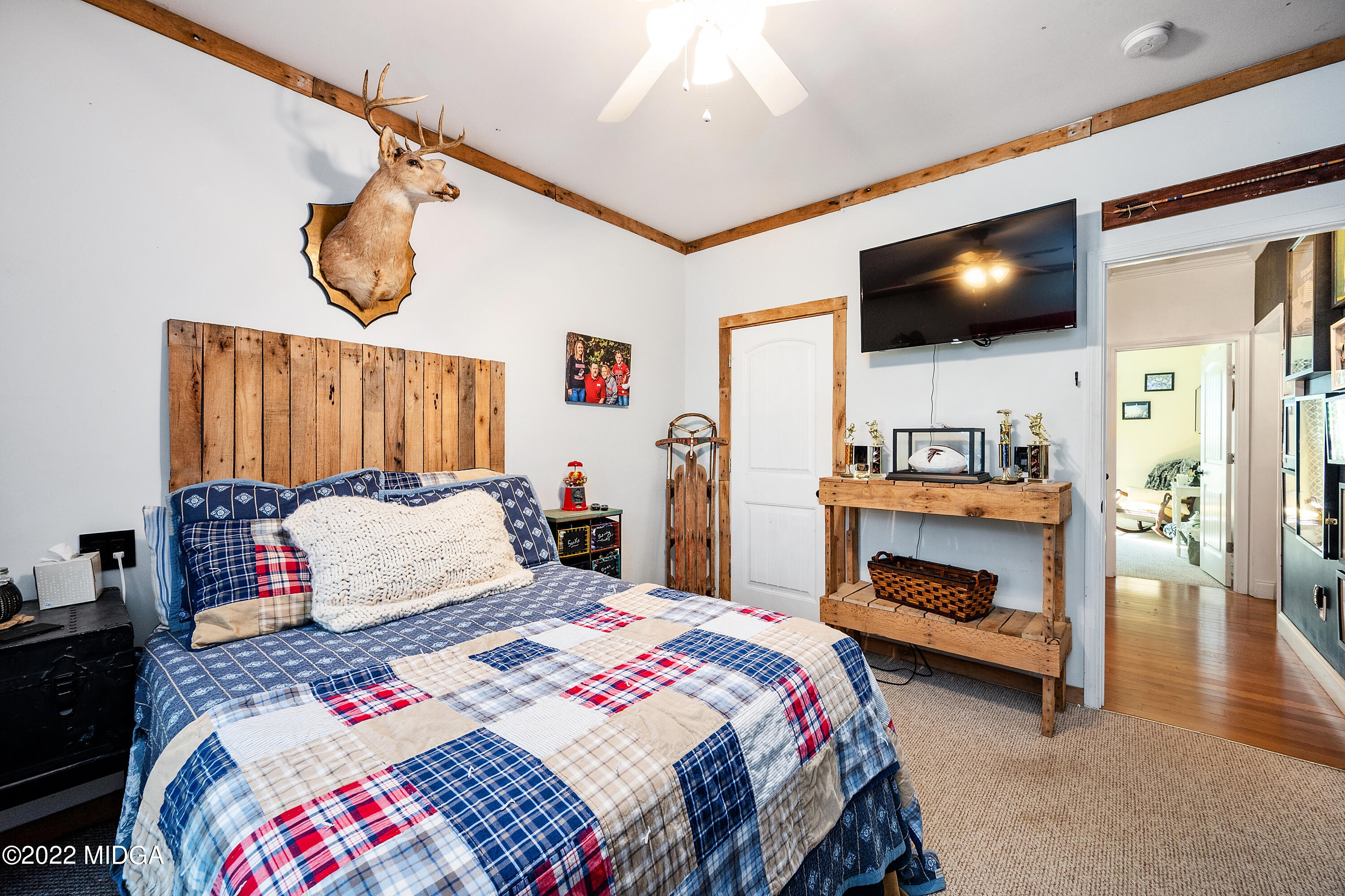 500 Gregory Road Forsyth, GA 31029 - Photo 29 of 47 a bedroom with a bed and a flat screen tv