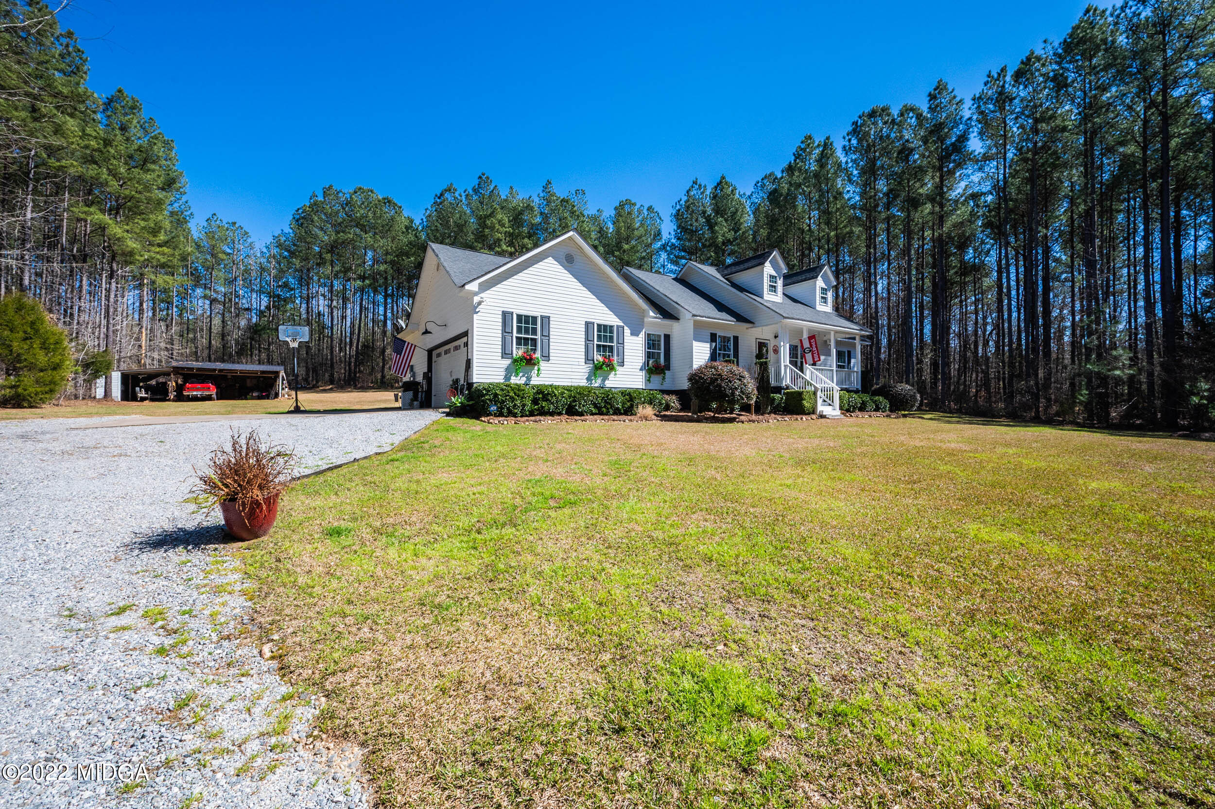 500 Gregory Road Forsyth, GA 31029 - Photo 45 of 47 a front view of a house with a yard and trees