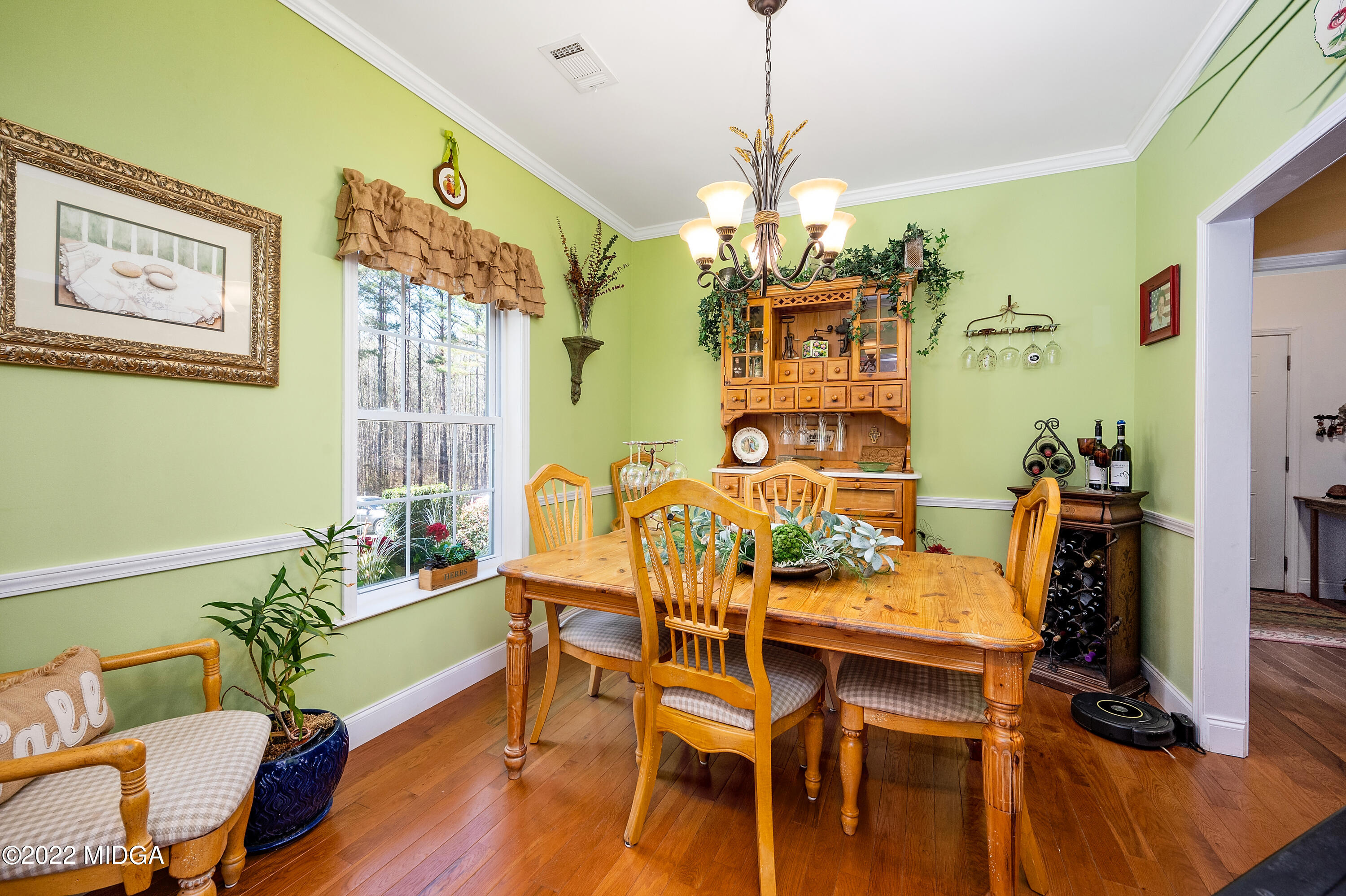 500 Gregory Road Forsyth, GA 31029 - Photo 9 of 47 a view of a dining room with furniture and wooden floor