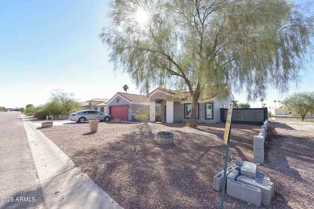 a swimming pool with outdoor seating and yard