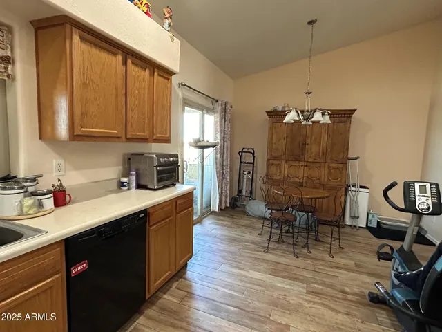 a kitchen with a sink cabinets and window