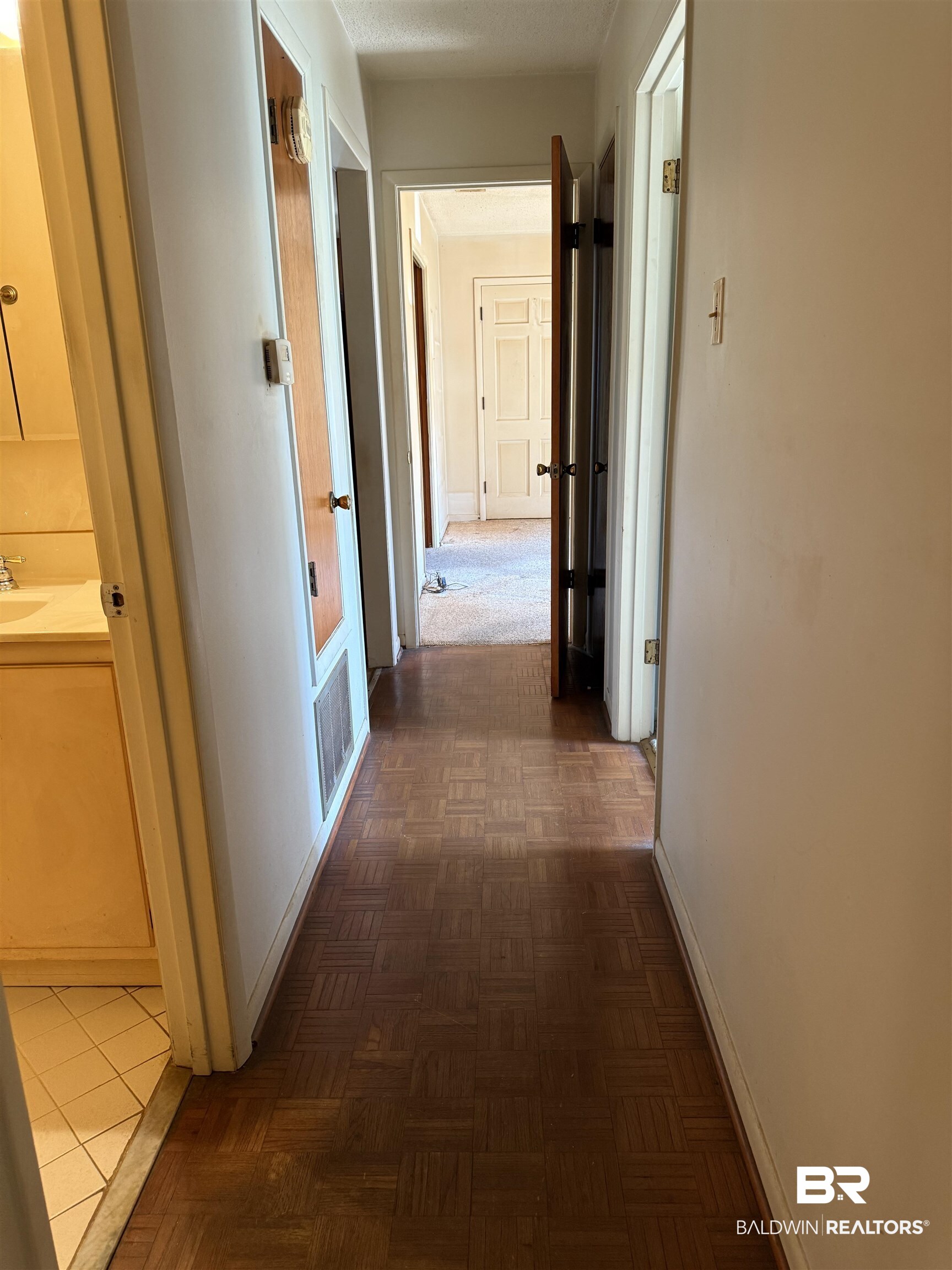 607 West Lee Street Mobile, AL 36611 - Photo 7 of 11 Hallway with baseboards and french doors
