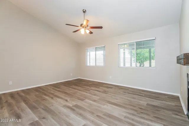 a view of an empty room with a window
