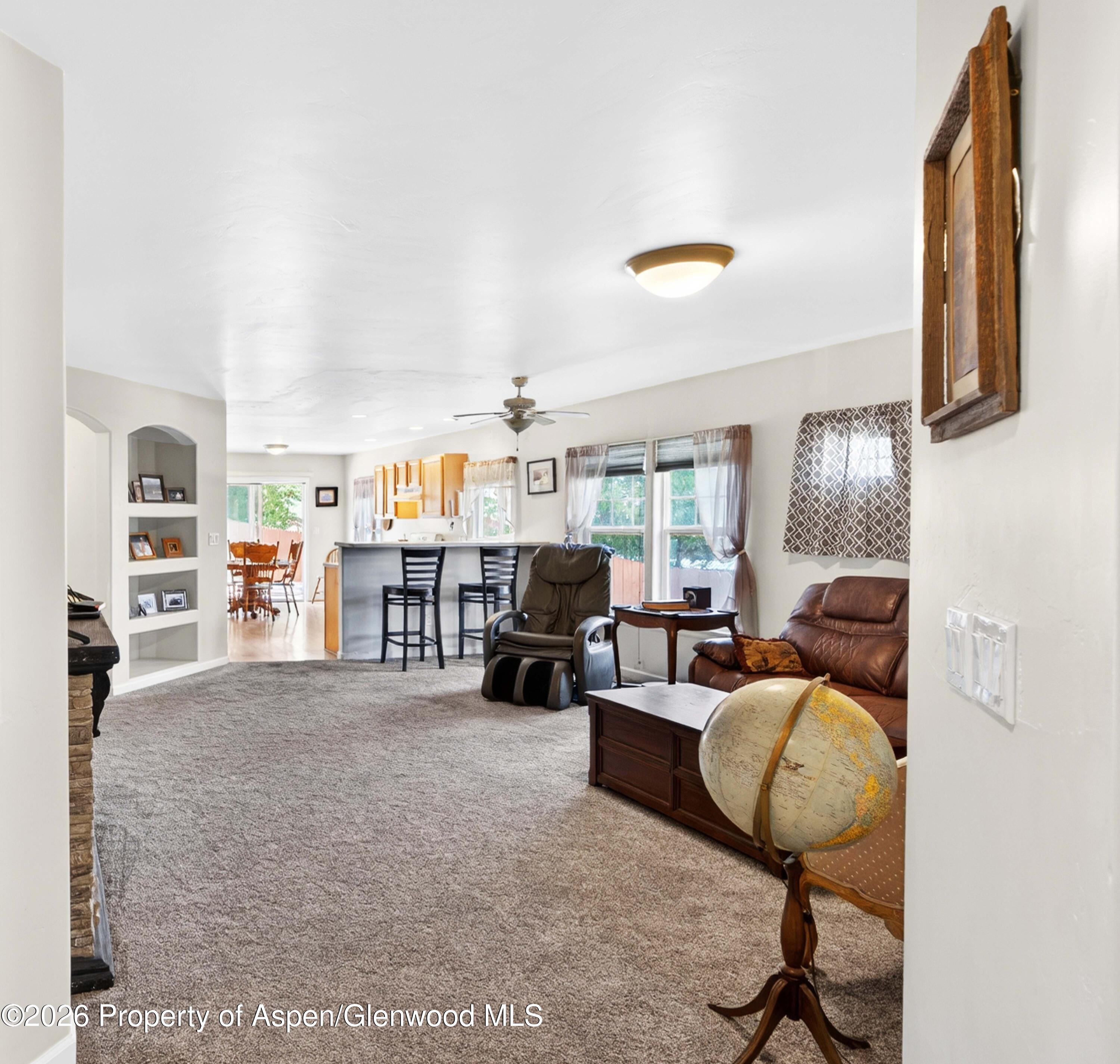 608 Lariat Loop New Castle, CO 81647 - Photo 7 of 32 a living room with furniture and a fireplace