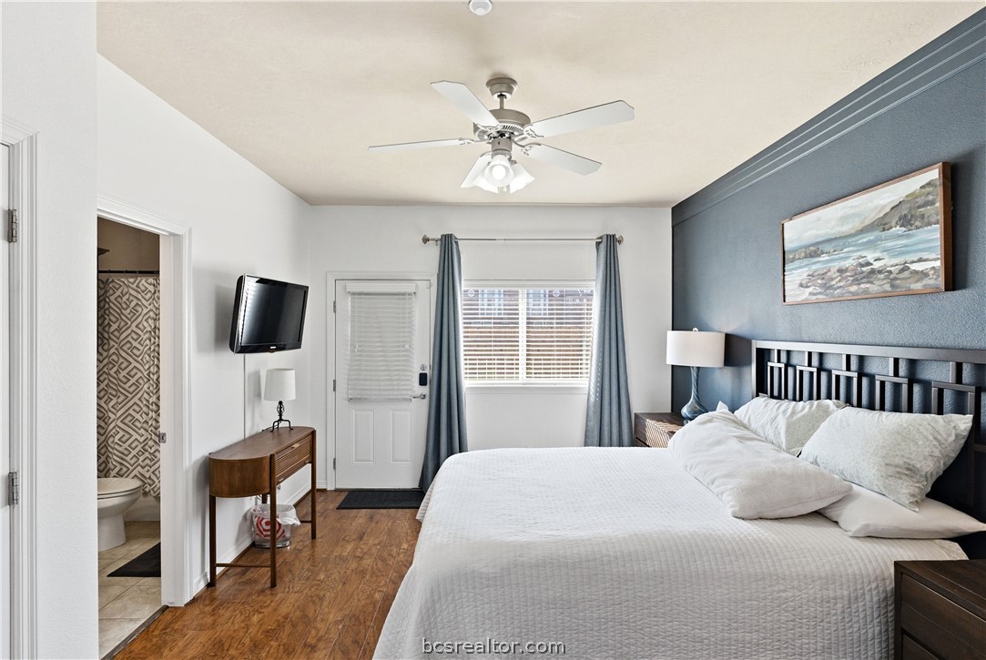 1198 Jones-Butler Road, Unit 1508 College Station, TX 77840 - Photo 12 of 18 a bedroom with a large bed and a chandelier