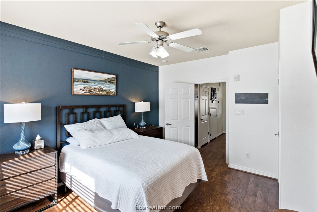 1198 Jones-Butler Road, Unit 1508 College Station, TX 77840 - Photo 13 of 18 a bedroom with a bed and a chandelier