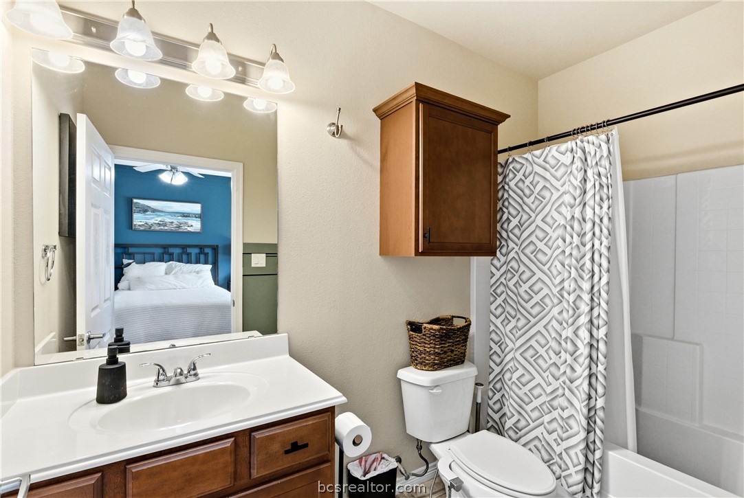 1198 Jones-Butler Road, Unit 1508 College Station, TX 77840 - Photo 14 of 18 a bathroom with a sink vanity mirror and toilet