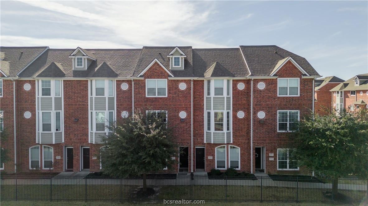1198 Jones-Butler Road, Unit 1508 College Station, TX 77840 - Photo 18 of 18 a front view of a residential apartment building with a yard